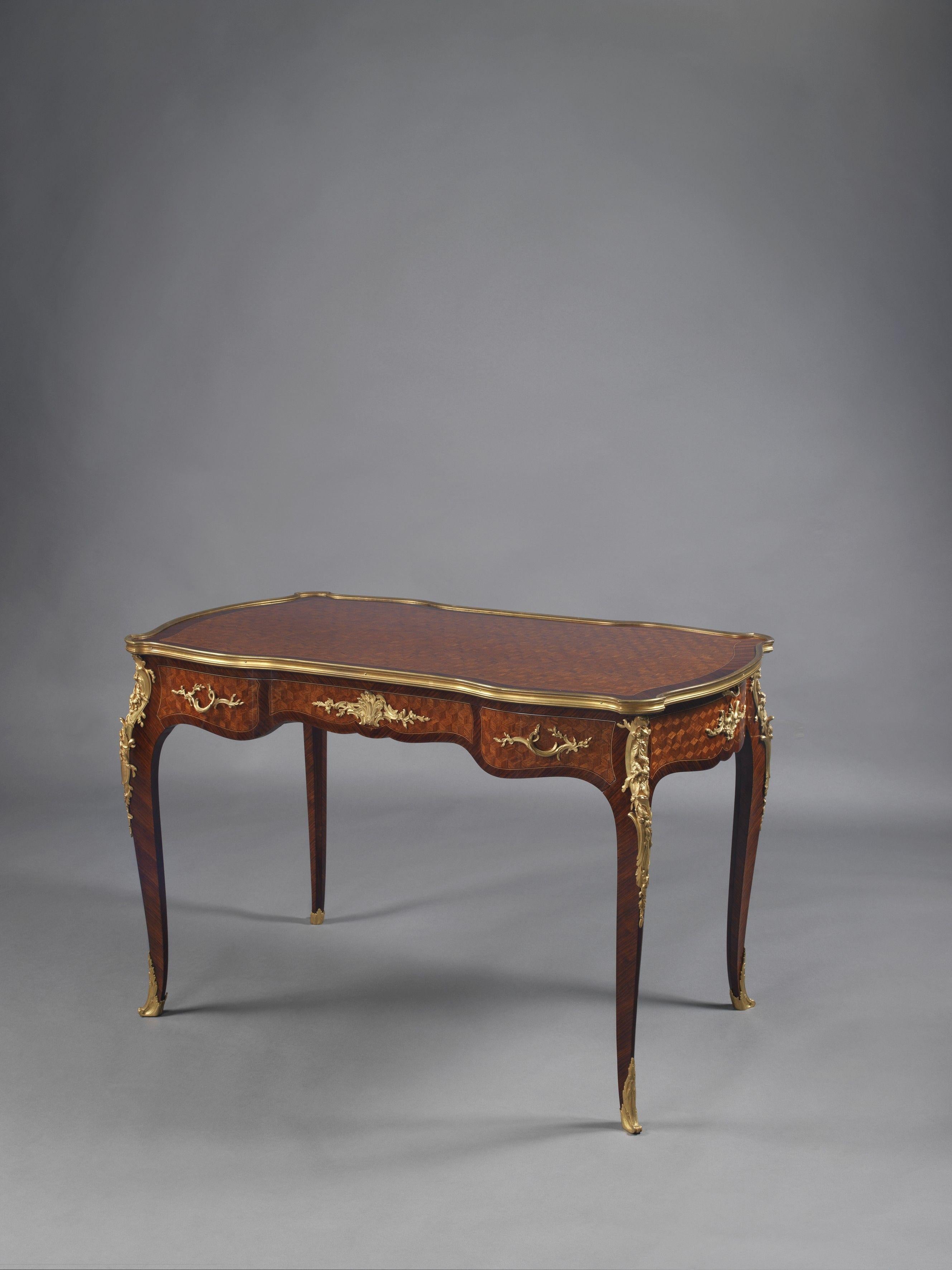 A Louis XV Style gilt bronze-mounted parquetry inlaid writing-table, by François Linke.

French, circa 1890.

Stamped 'FL' to the reverse of the centre bronze mounts to the front and back and to the handles. Stamped '2519 LINKE' to the reverse