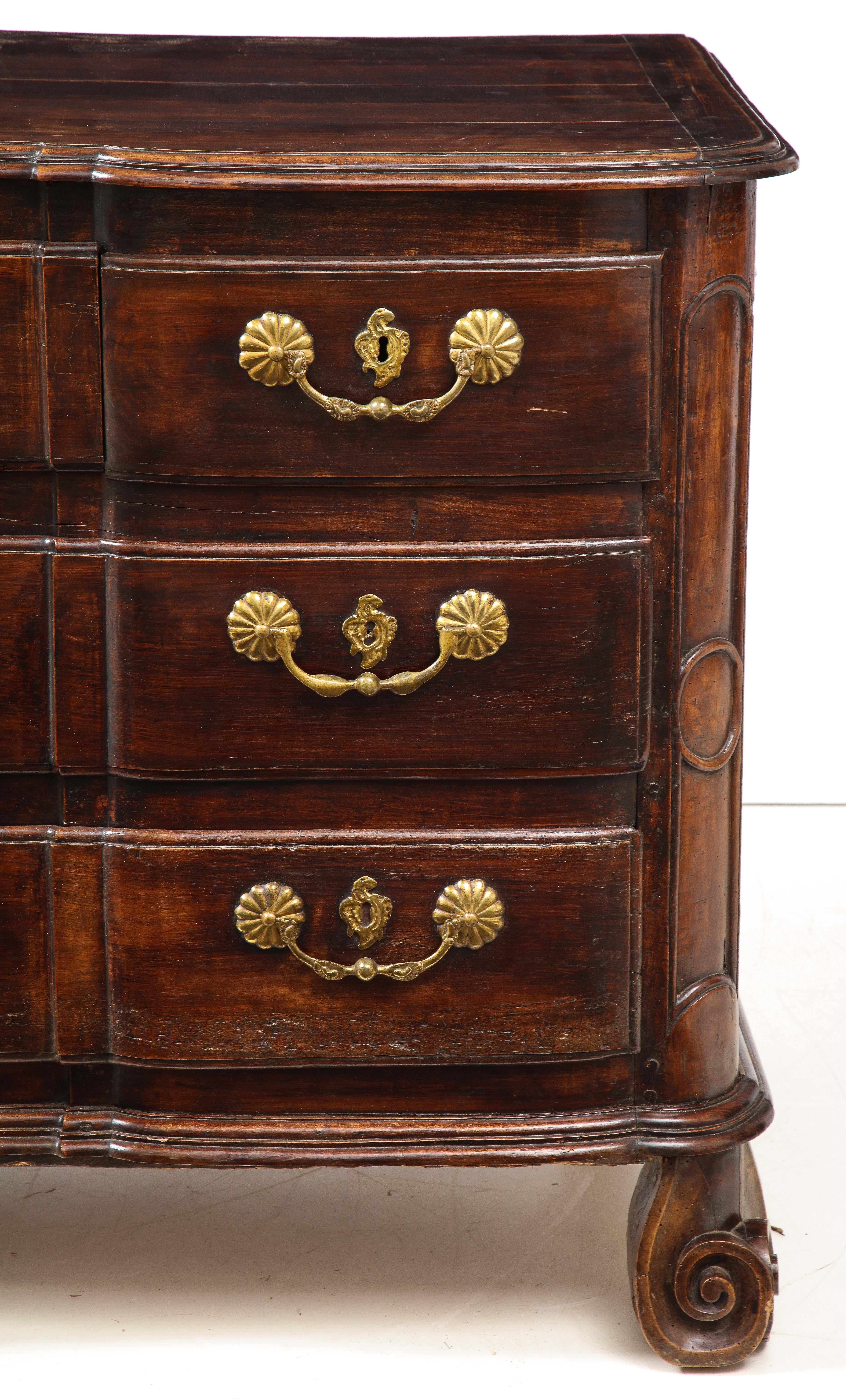 This large 19th century piece will add character and personality to a room. In a wonderfully rich dark oak, this chest is raised on escargot feet and features three drawers with original beautiful brass hardware.

Measures: Height 39 x length 56 x