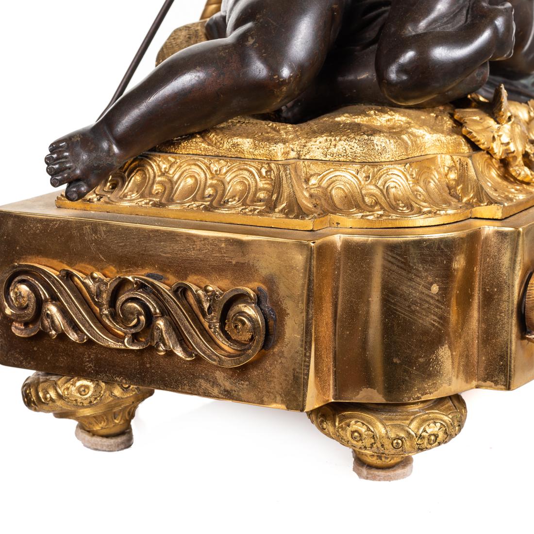 A Louis XVI gilt and patinated bronze lamp
after the model by Louis-Simon Boizot,
Late 19th century
Surmounted by two cherubs, drilled for electricity
Measures: Height 27 in. (68.58 cm.)
Width 10 in. (25.4 cm.),
Depth 6.5 in. (16.51 cm.).
 