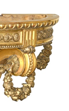 Console Louis XVI en bois doré