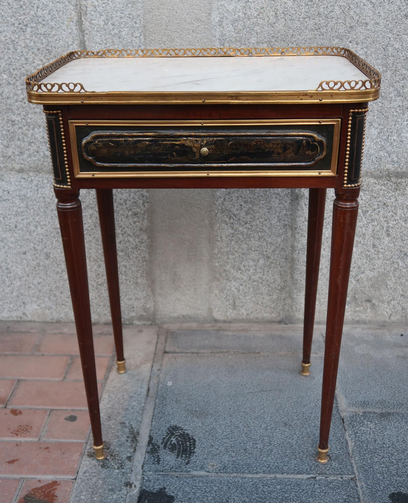 A Louis XVI mahogany, brass and marble signed table, France, 18th century.