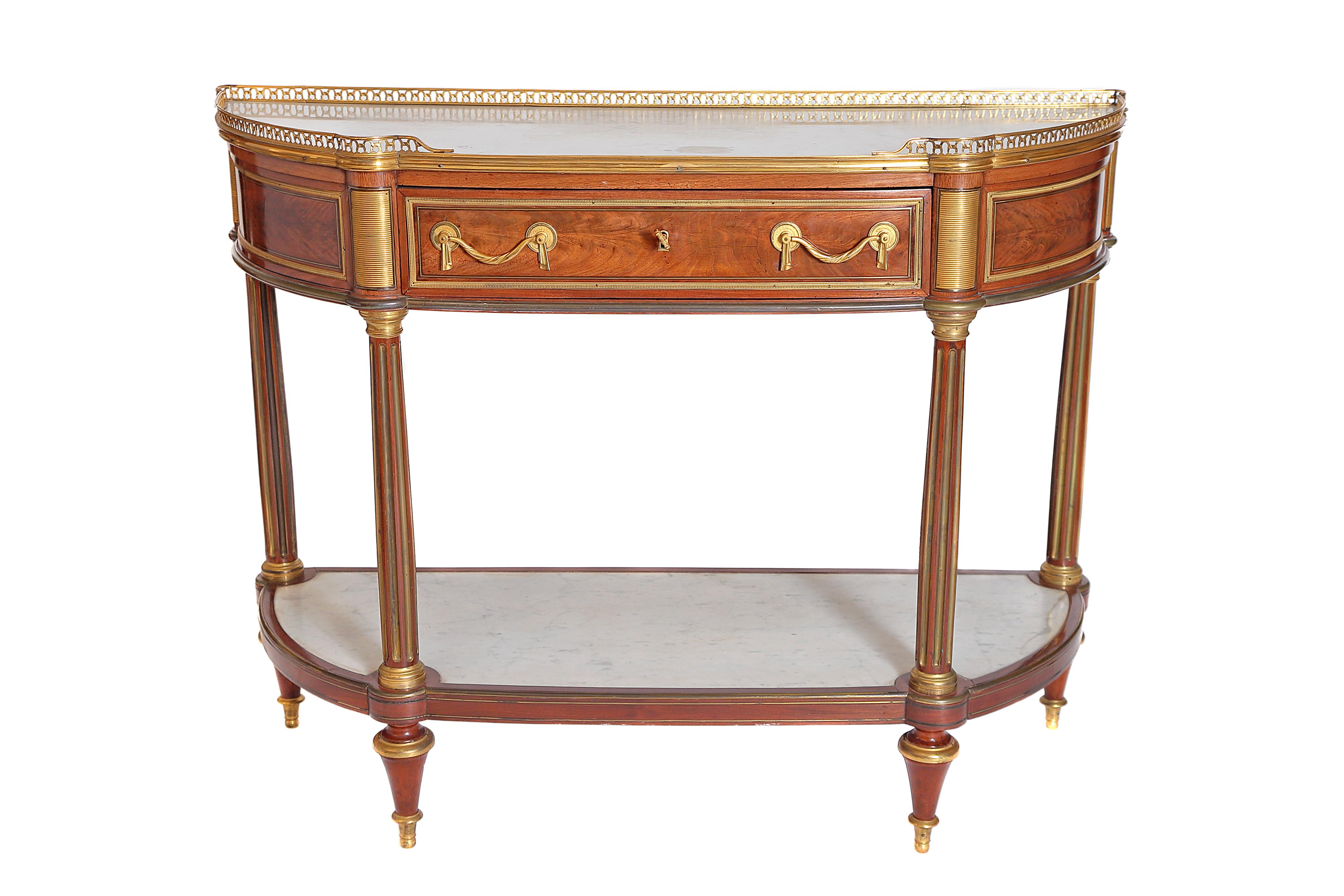 A Louis XVI ormolu and white marble mounted flame mahogany console desserte, stamped 