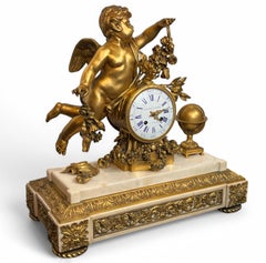 A Louis XVI Ormolu and White Marble Mantel Clock of Cupid