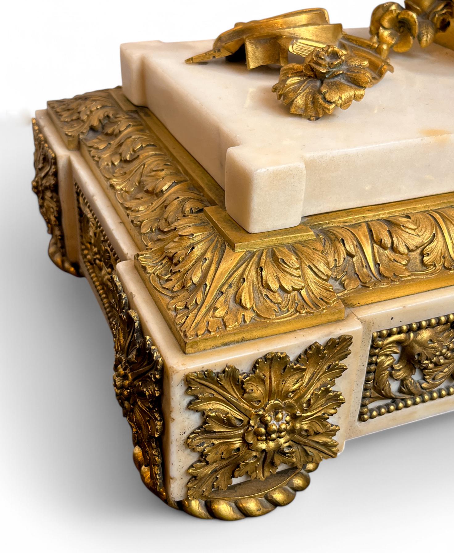 A Louis XVI Ormolu and White Marble Mantel Clock of Cupid For Sale 2
