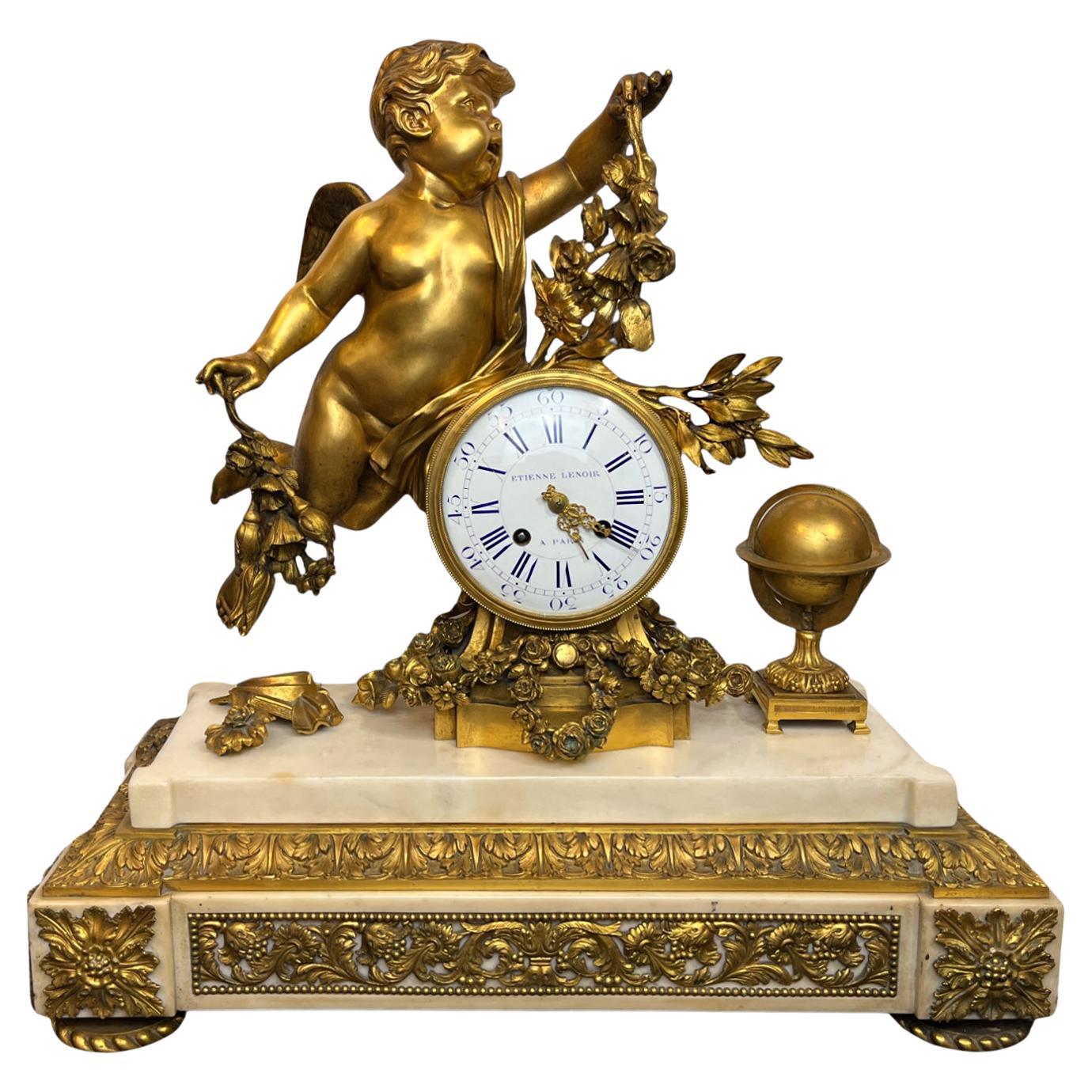 A Louis XVI Ormolu and White Marble Mantel Clock of Cupid