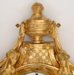 A Louis XVI Ormolu Figural Cartel Clock