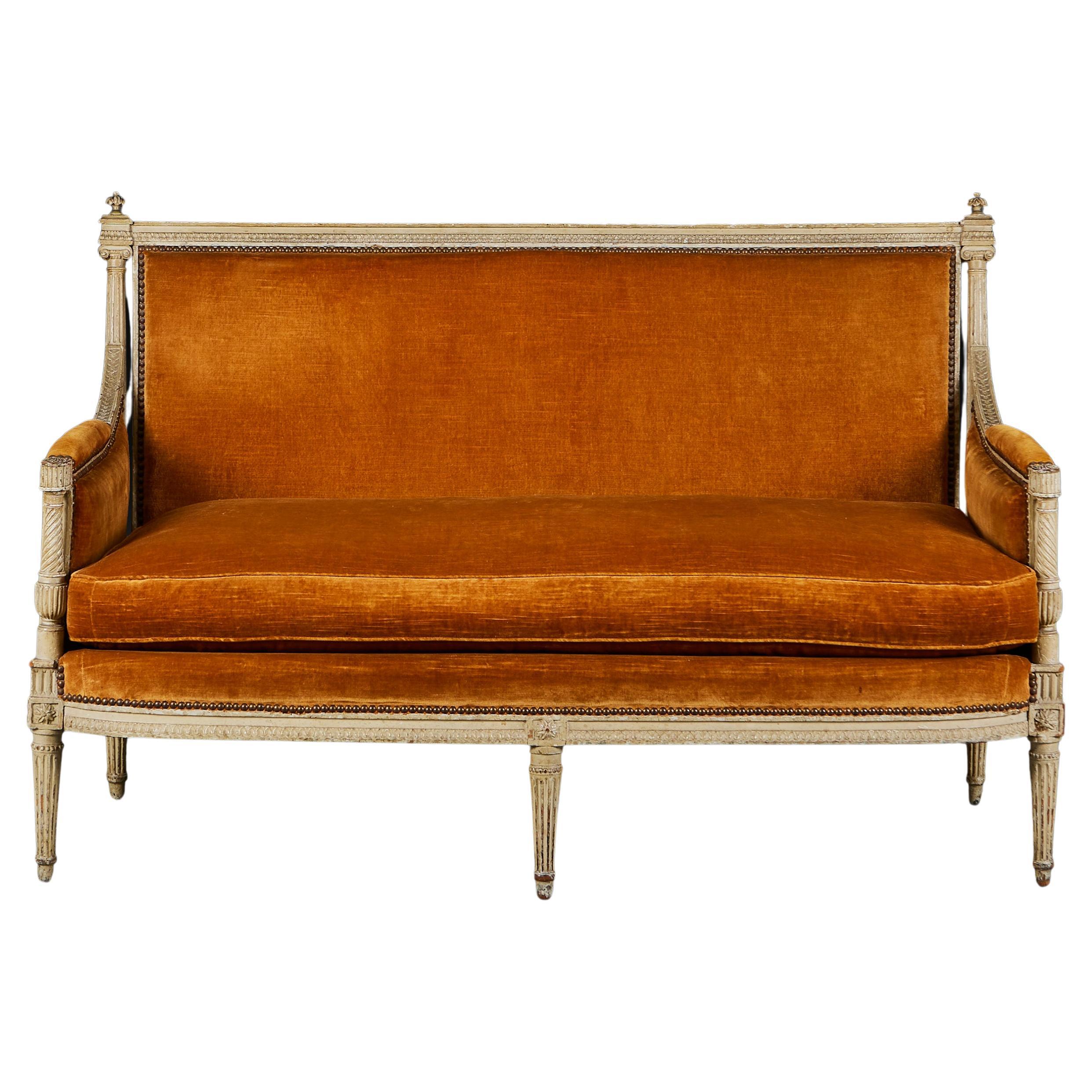 A Louis XVI Sofa Upholstered in Burnt Orange Velvet