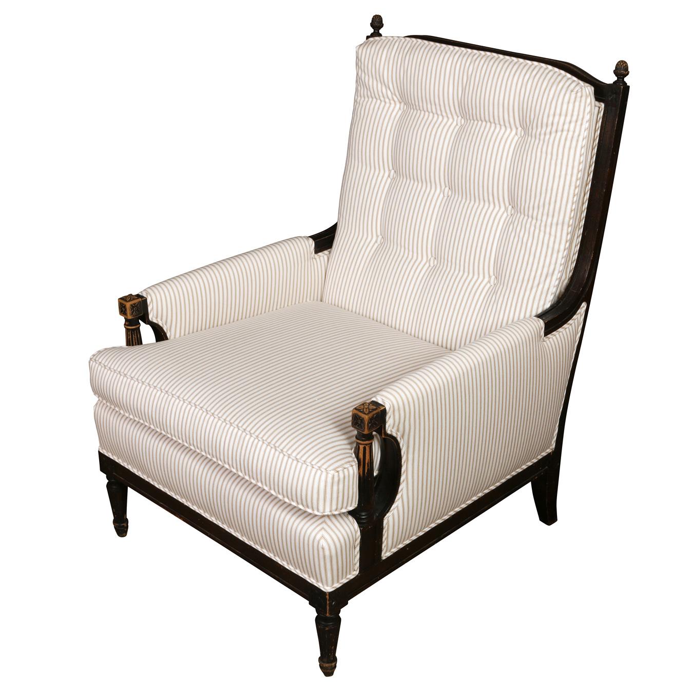 This Louis XVI Style Arm Chair showcases timeless elegance with a contemporary touch. Upholstered in a crisp tan and white ticking stripe, it exudes chic sophistication. The chair’s ebonized finish on the finely carved wood frame adds a sleek,