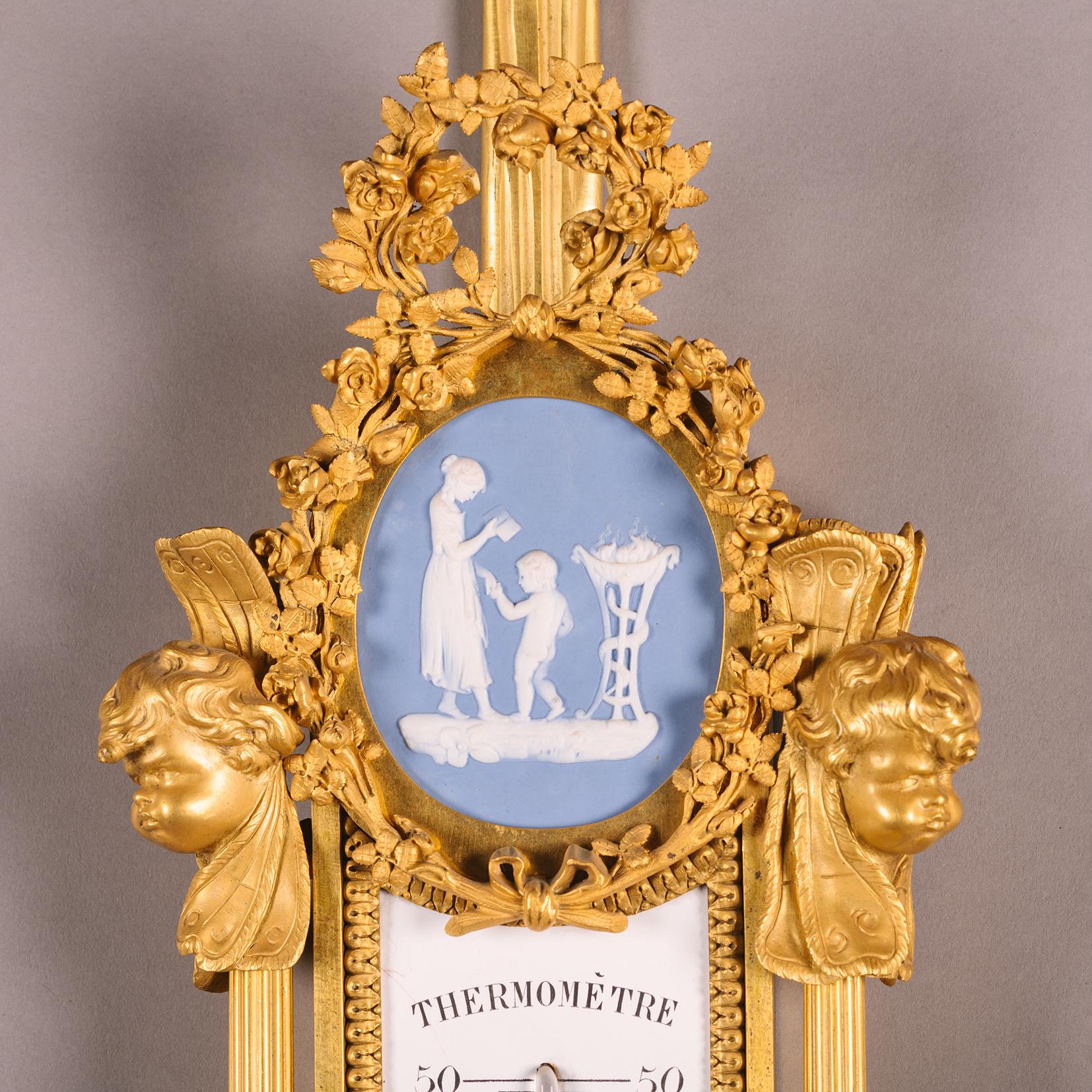A Louis XVI Style Cartel Clock and Barometer After Pierre Gouthière For Sale 1