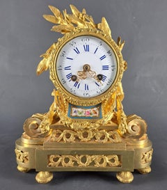 A Louis XVI Style Clock In Gilt Bronze And Sèvres Porcelain