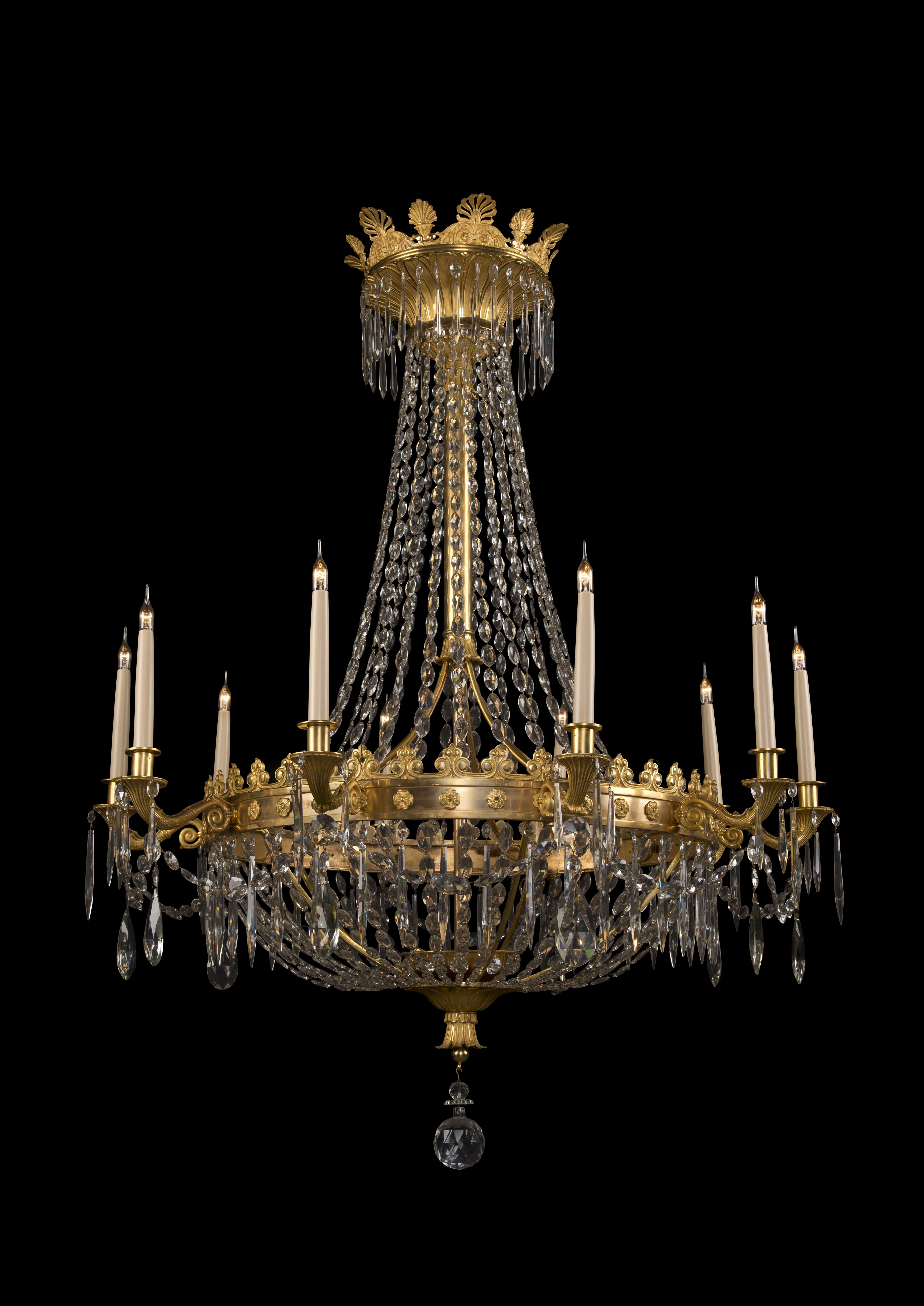 A fine Louis XVI style gilt-bronze and cut-glass ten-light tent and bag chandelier.

French, circa 1900. 

This impressive chandelier has a gilt-bronze crown cast with anthemions suspending chains of cut-glass beads to a gilt-bronze gallery cast