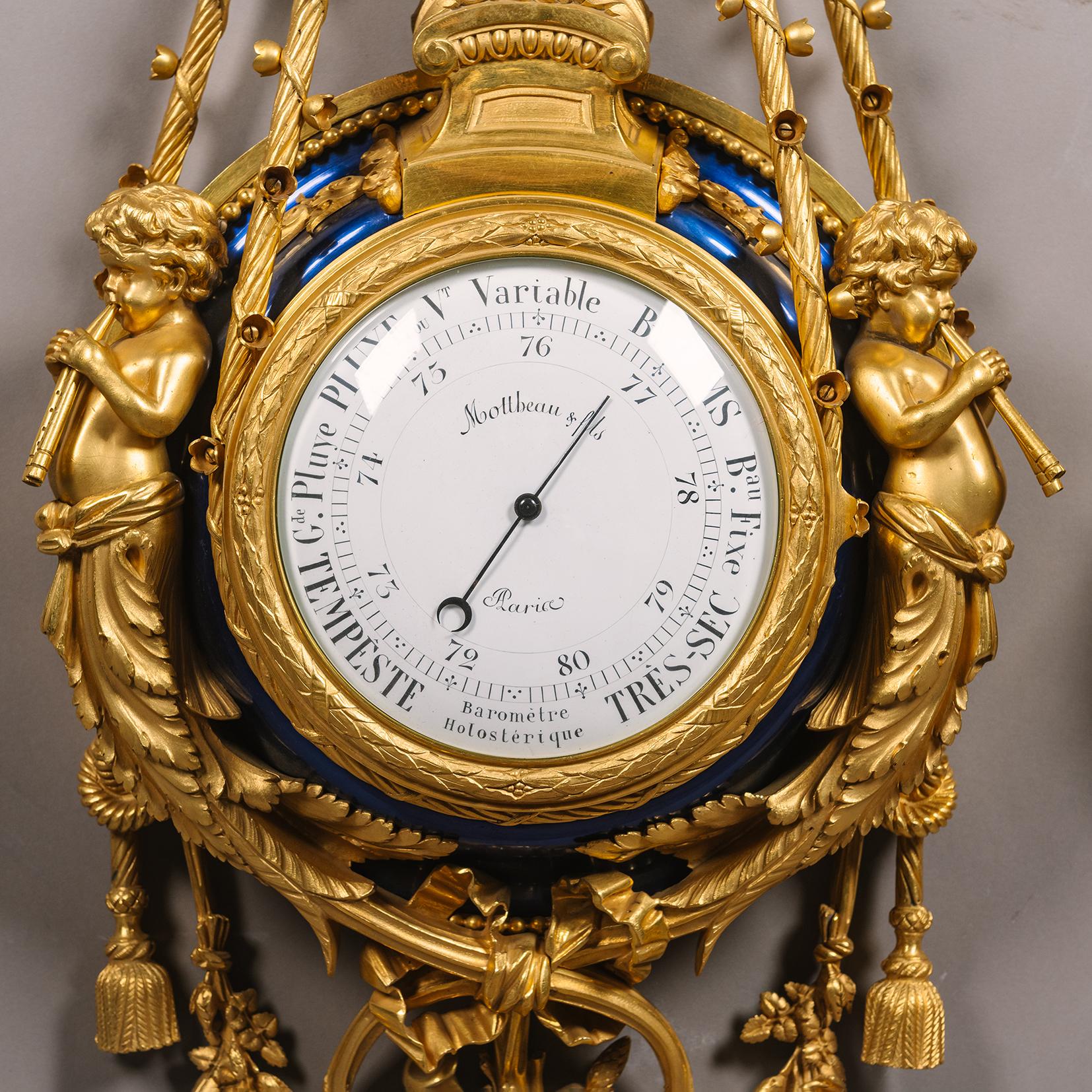 A Louis XVI Style Gilt-Bronze and Blue Enamel Cartel Clock and Barometer, By Maison Mottheau & Fils., Paris.

This exceptional cartel clock and aneroid barometer exhibit the finest production of the bronzier Mottheau & Fils of Paris. The clock