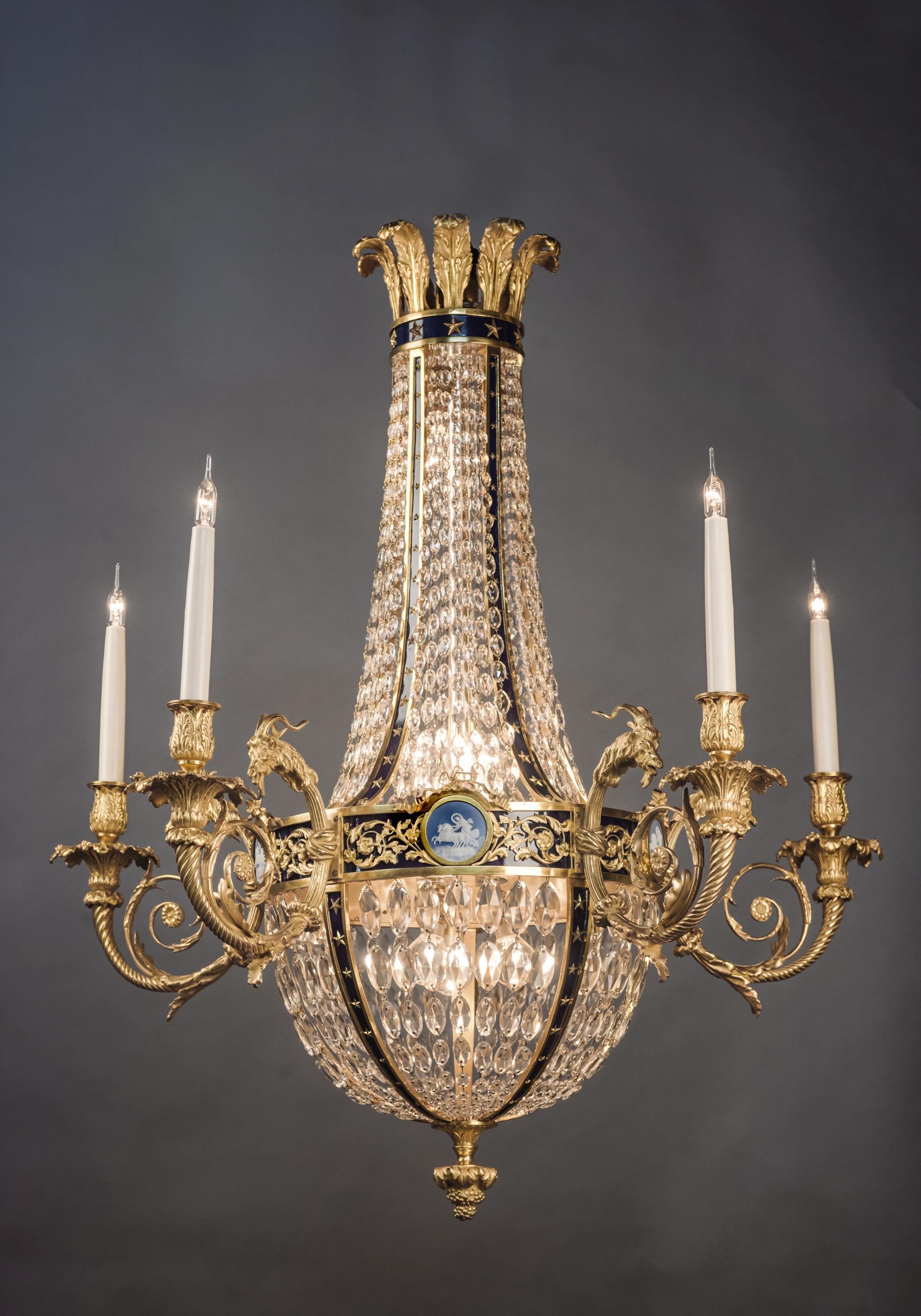 A Louis XVI style gilt bronze and cut-glass basket chandelier with jasperware plaques, in the manner of Pierre Gouthière.

French, circa 1900. 

The chandelier has five external and nine internal light fitments. 

This fine chandelier has a