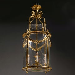 Zylindrische Laterne mit vier Lichtern aus vergoldeter Bronze im Louis-XVI-Stil