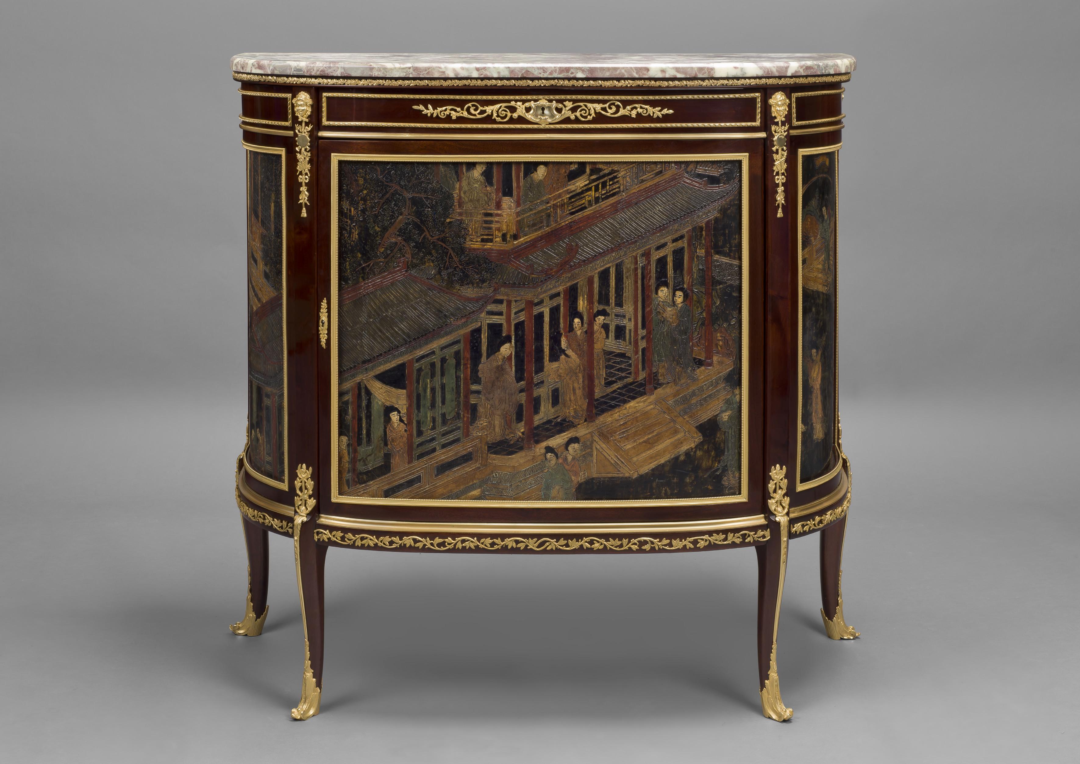 A fine Louis XVI Style gilt bronze mounted mahogany and Coromandel lacquer, demilune commode, by François Linke.

French, circa 1890. 

Signed 'Linke' to the gilt bronze mounts. 

This fine commode has a shaped marble top above a gilt bronze
