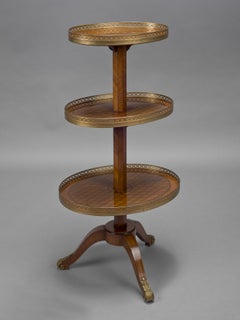 A Louis XVI Style Oval Three Tier Gueridon