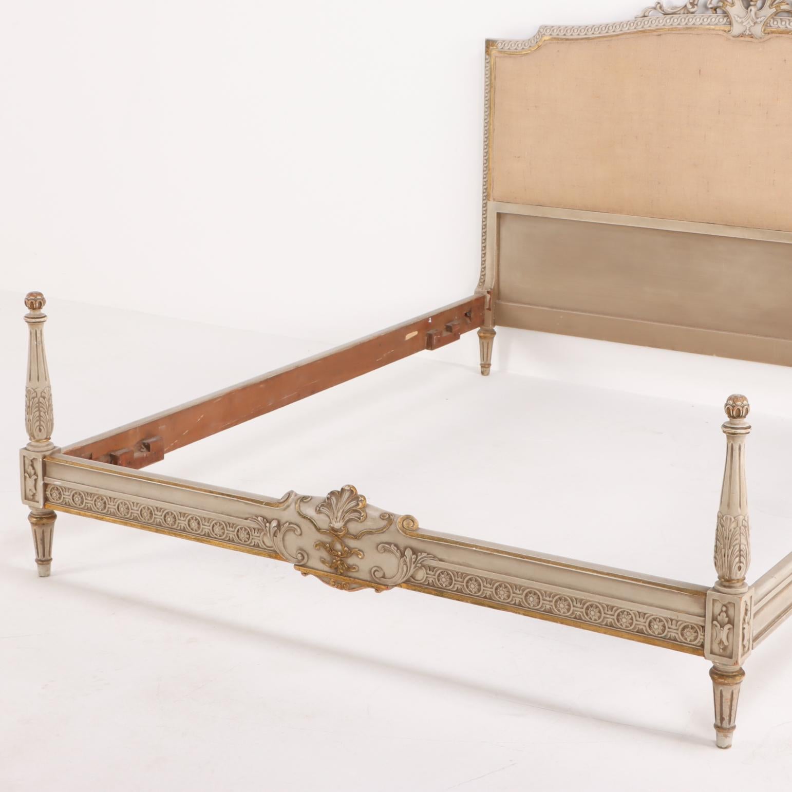 This queen size bed has a very nice painted surface and burlap upholstery. Both the head and foot board having a nicely detailed cartouche. Interior dimensions: 60
