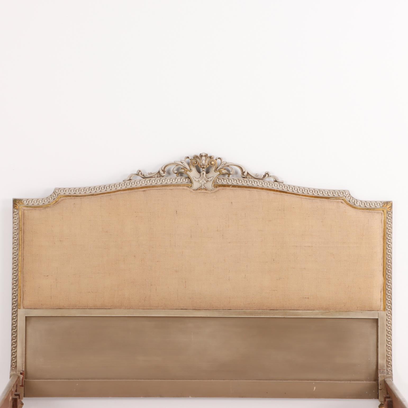 A Louis XVI style painted and gilt carved wood bed, C. 1930. In Good Condition For Sale In Philadelphia, PA