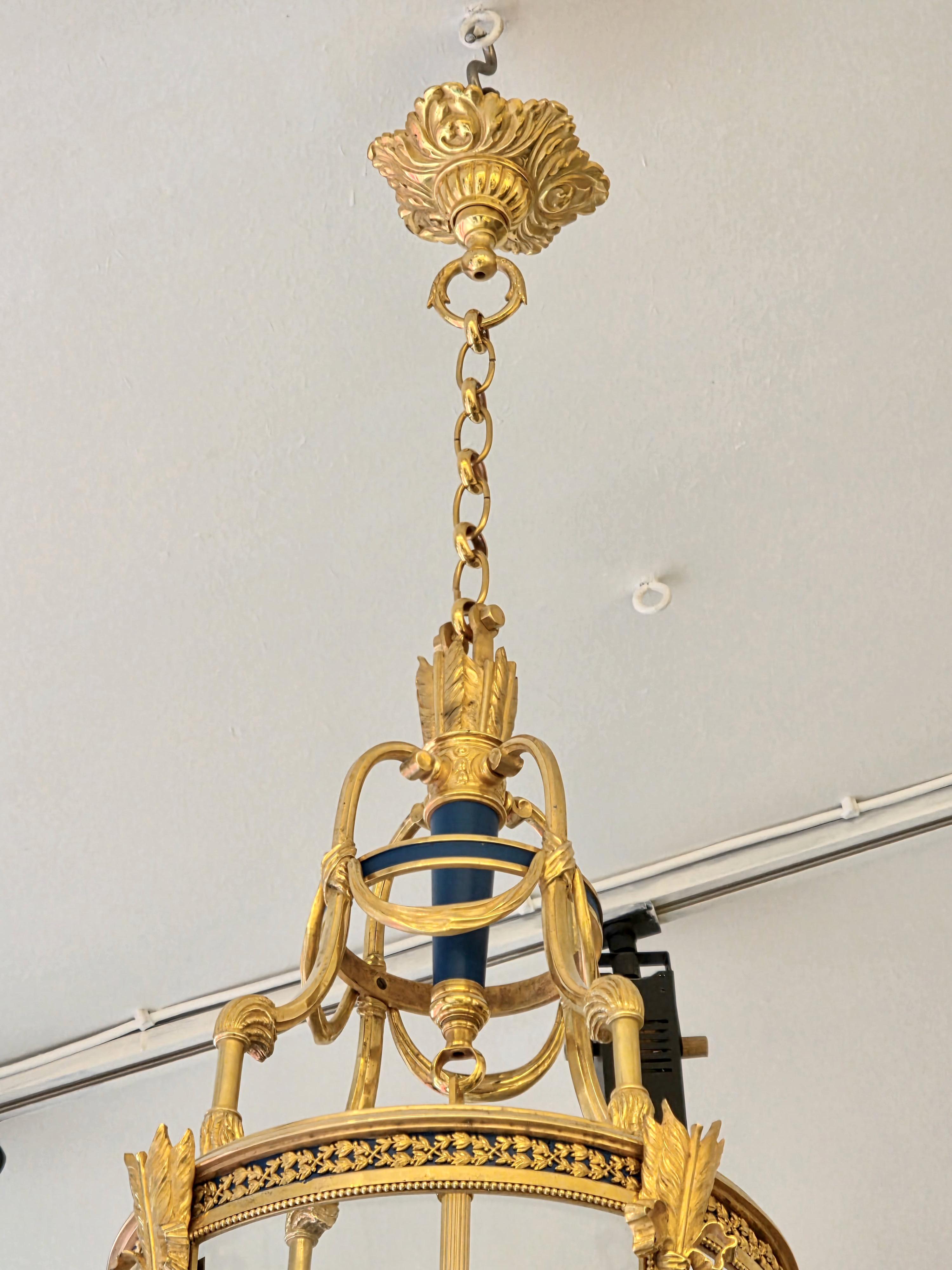 A Louis XVI Style Patinated and Gilt Bronze Four Light Hall Lantern, circa 1880 In Good Condition For Sale In Saint-Ouen, FR