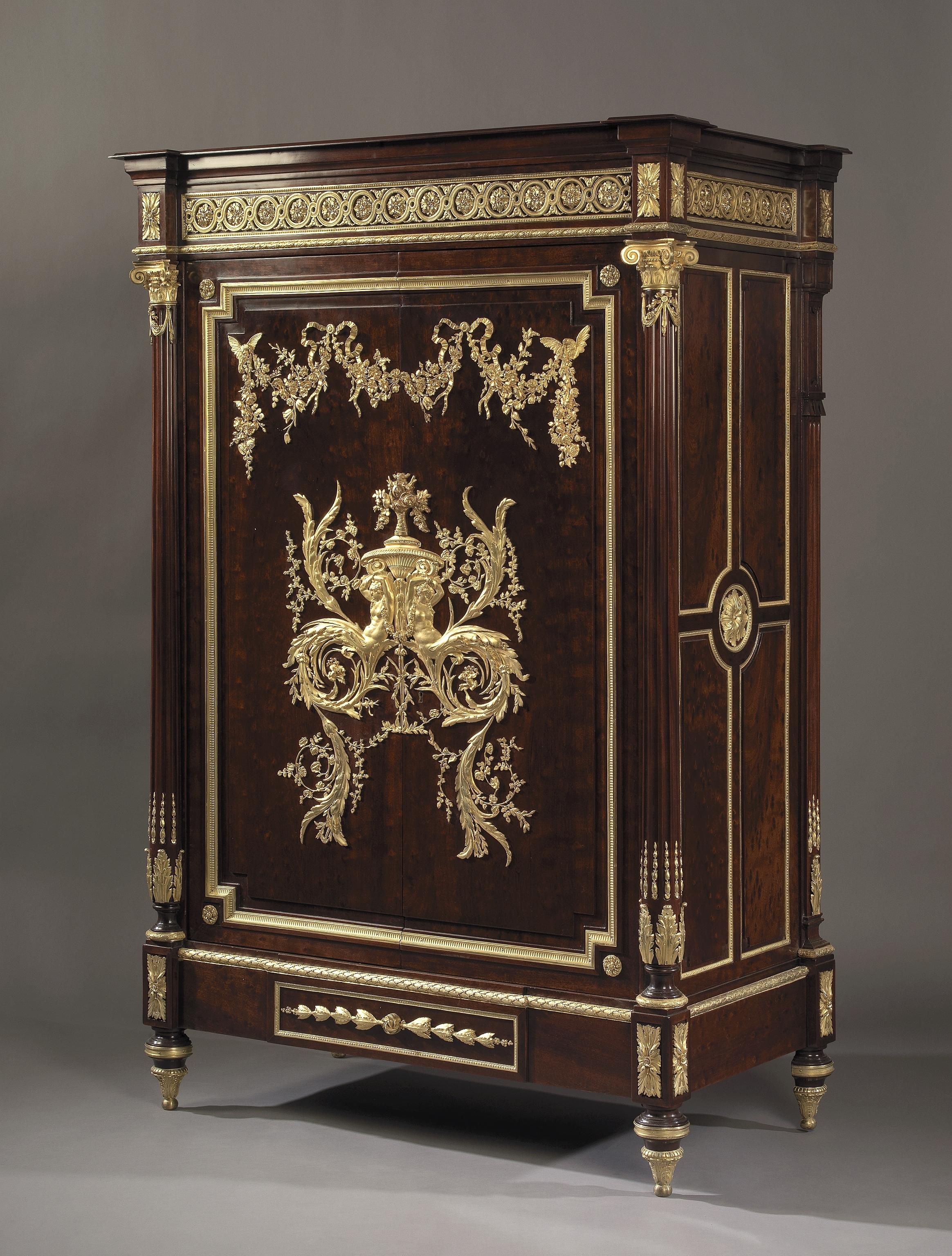A Louis XVI style gilt bronze-mounted plum-pudding mahogany Bas d’Armoire.

French, circa 1880.

The lock stamped ‘DUBOIS FT A PARIS’. 

This fine cabinet has a rectangular top above a pair of cupboard doors centred by incredible gilt-bronze