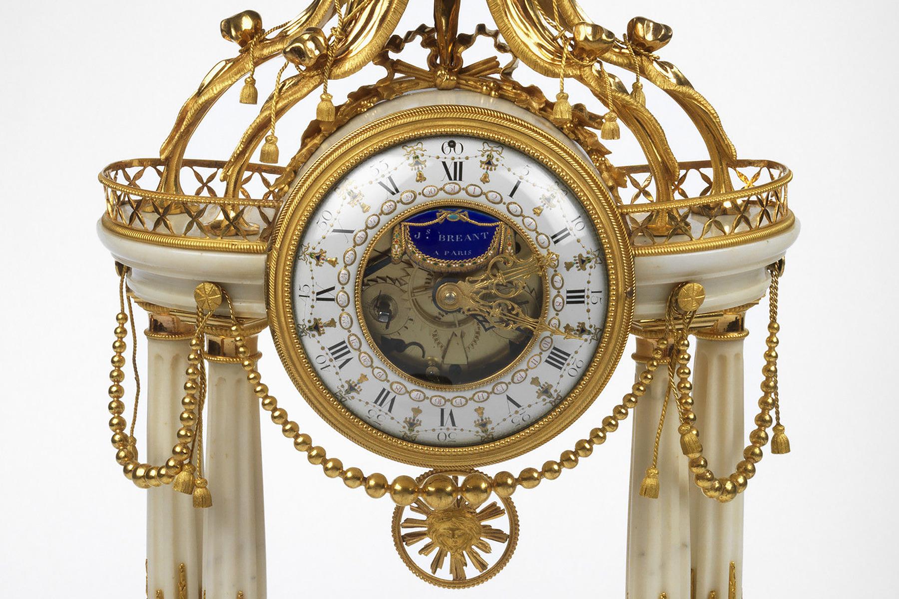 The circular enamel dial is signed Coteau and J S Breant/à Paris on a blue enamel plaque, suspended above the hands of the dial. This has black Roman numerals indicating the hours and small black numerals indicating the days of the month. It has a