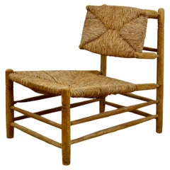 A lounge chair from France - Straw and wood - 1950s