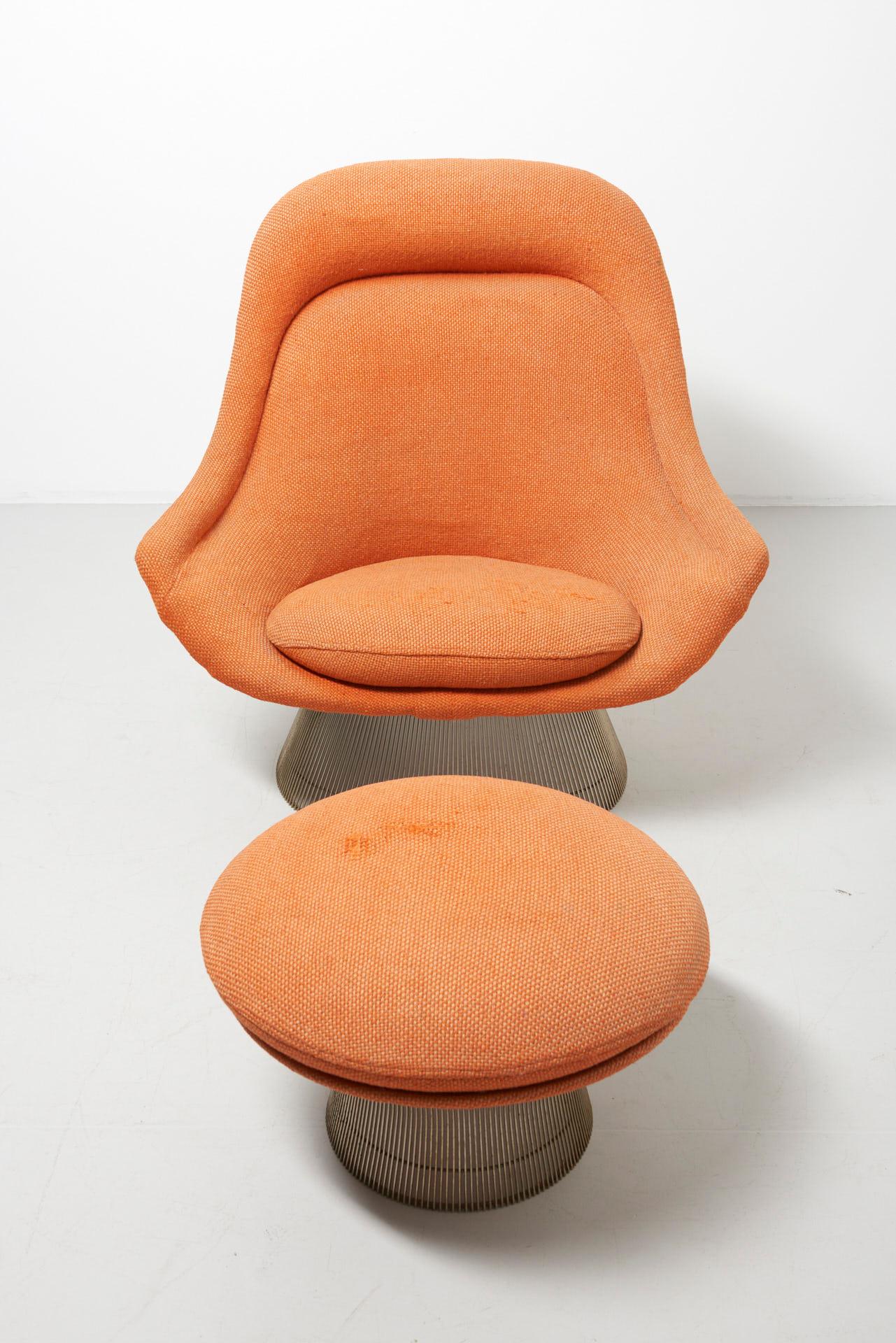 A 'model 1705' lounge chair with ottoman. Design by Warren Platner in 1966 for Knoll International. Made of nickelled steel and the original -faded- orange fabric. This iconic easy chair by Warren Platner is created by welding curved steel rods to