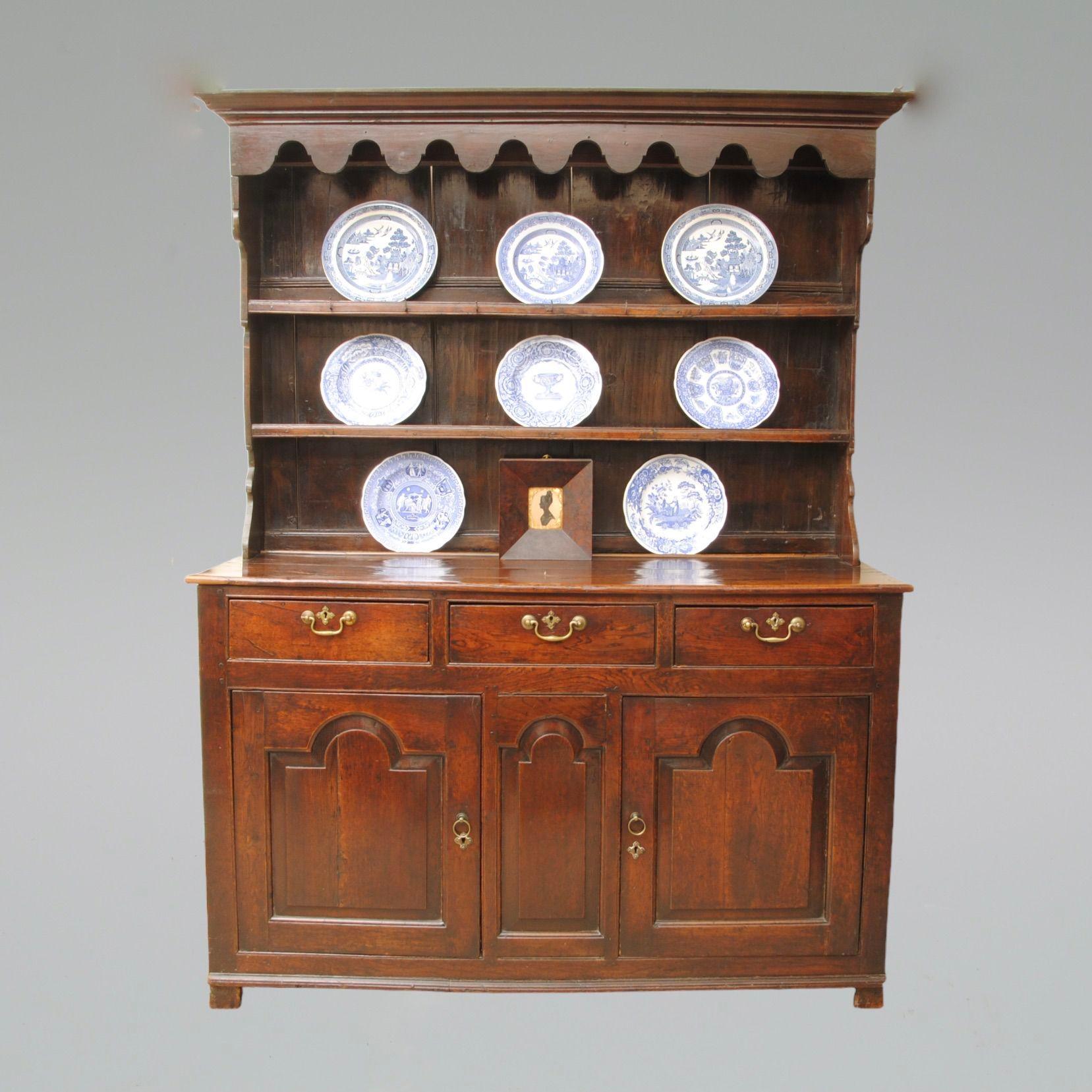 A super 18th century welsh oak dresser and original rack, with arch shaped panels and top frieze, the whole of a wonderful rich warm colour with a fantastic patina.