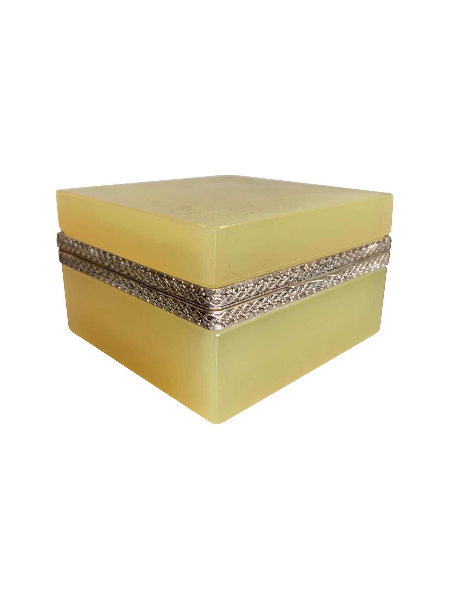 A lovely yellow Murano glass hinged jewelry box by Giovanni Cendese, Murano, Italy with silvered central detailed collar and hinge. 

 