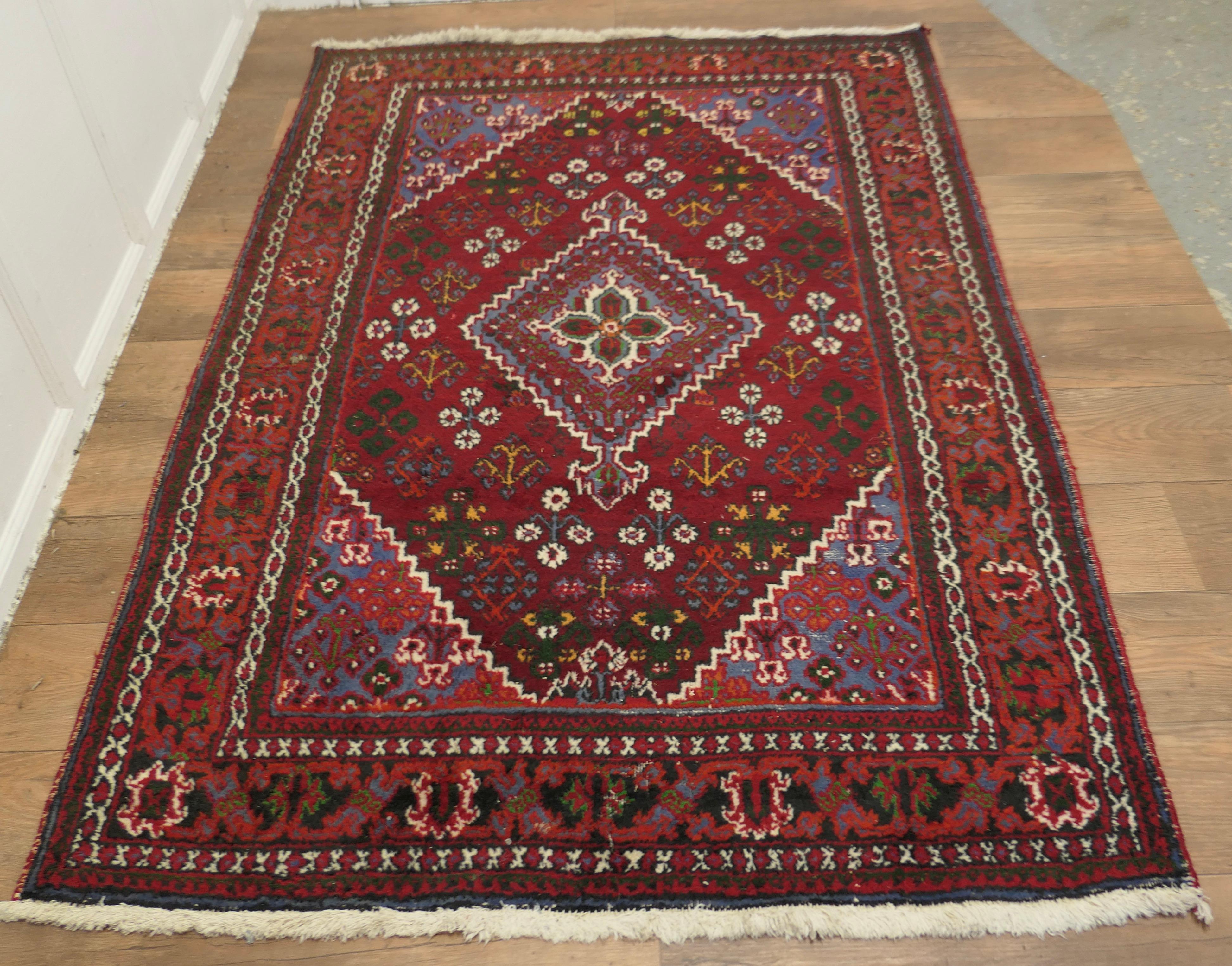A Lovely Bright Red Wool Rug, Tree of Life Pattern

The Carpet is a wonderful Bright colour with an attractive pattern and a wide border
This rug is from the the early 20th century it measures 80” x 53” the fringes are a little short and there is