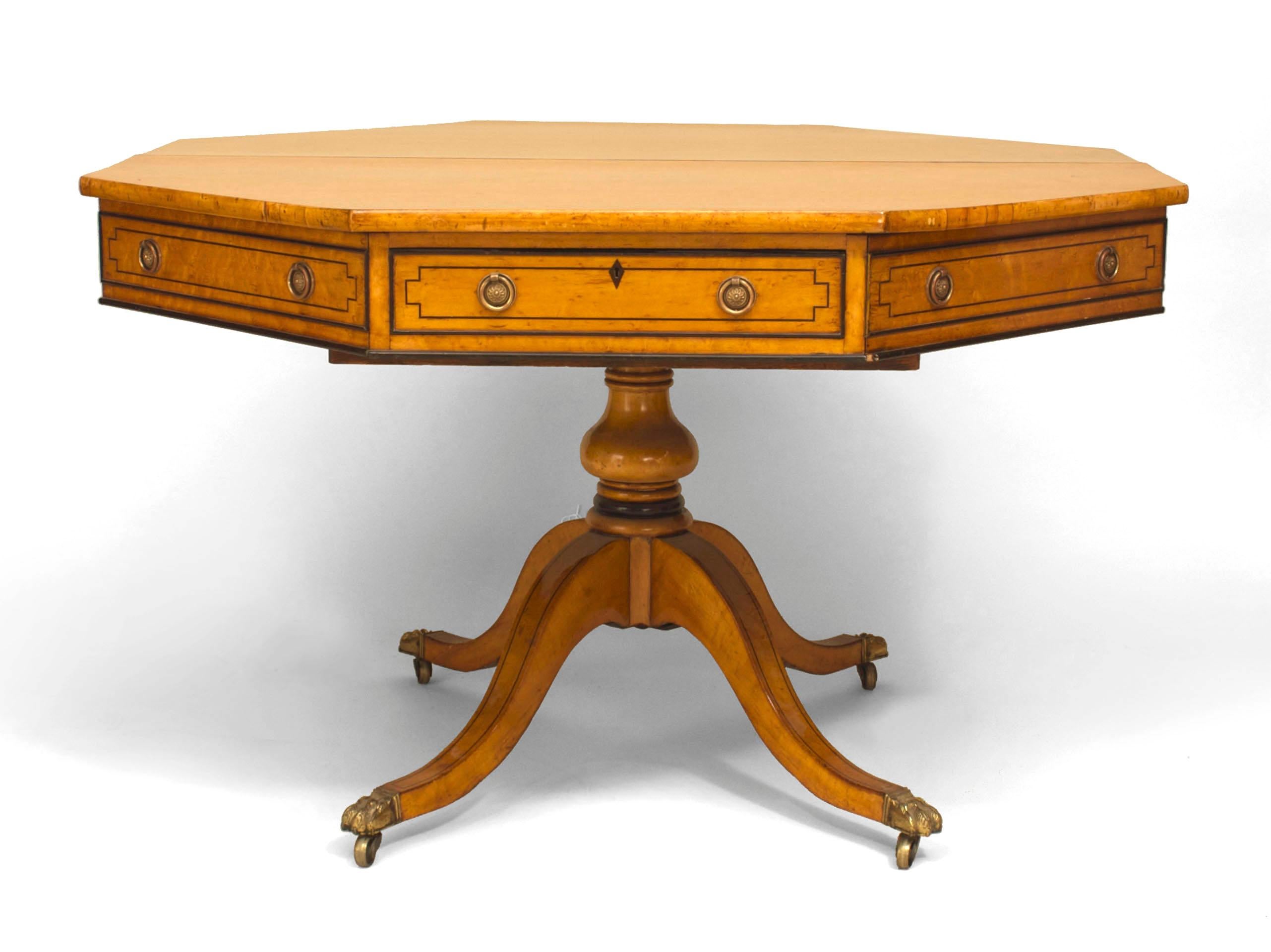 English Regency style (mid-19th Century) octagonal maple pedestal base center table with two drawers and resting on a pedestal base with 4 legs. (stamped: BLAIN & SON/ LIVERPOOL)
