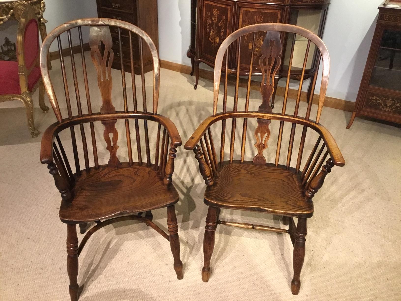 A lovely harlequin set of six 19th century ash and elm antique Windsor armchairs. Comprising of four matching low back Windsor armchairs and two similar high back armchairs, each chair constructed using ash and elm with dished saddle seats in ash
