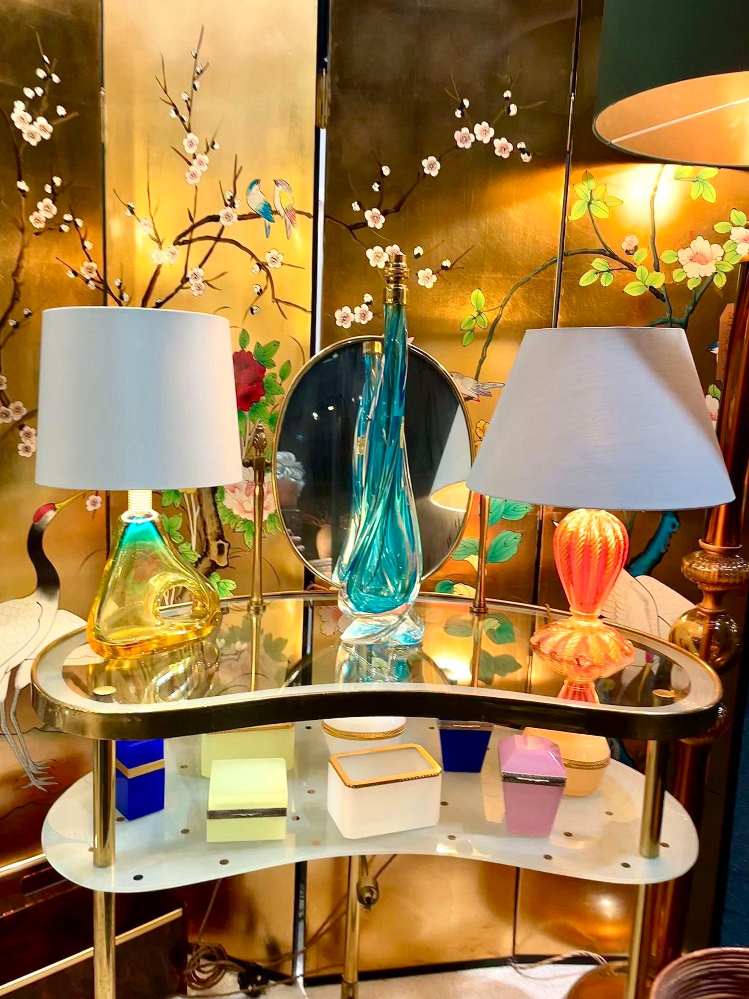 A lovely Italian 1950s brass and glass kidney shaped dressing table attributed to Luigi Brusotti for Modello Lamparte Depositato with under light beneath a lower polka doted frosted glass shelf. There is an extended brass switch for the light on a