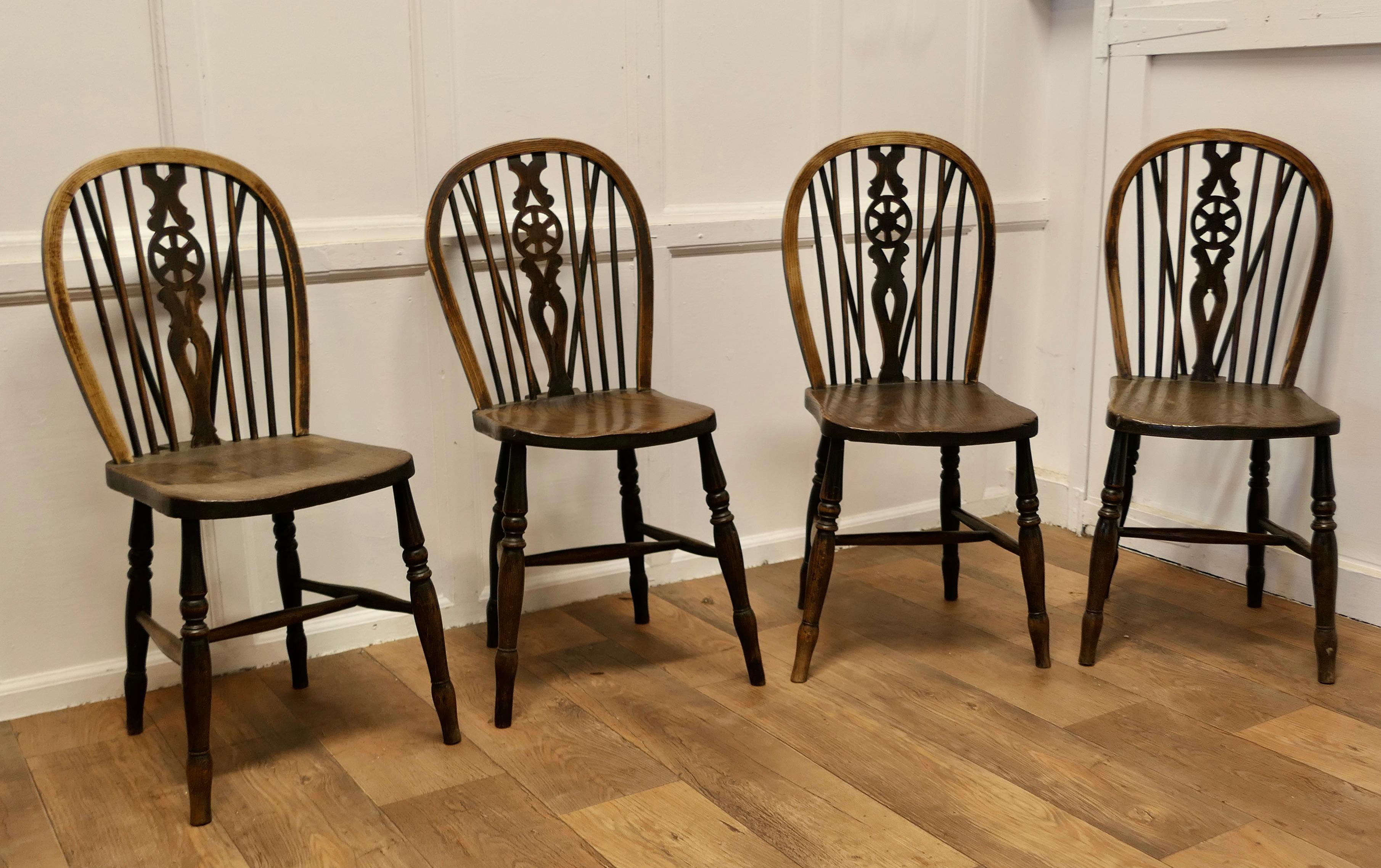 A Lovely Old Set of 4 Ash & Elm Wheel Back Windsor Kitchen Chairs


This is a 19th Century set, they are made in solid Ash and Em and have a hooped wedge back in the traditional Windsor style with spindles and a pierced centre splat in the shape of