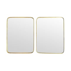 A lovely pair of 1950s Italian brass framed mirrors with solid wood backs
