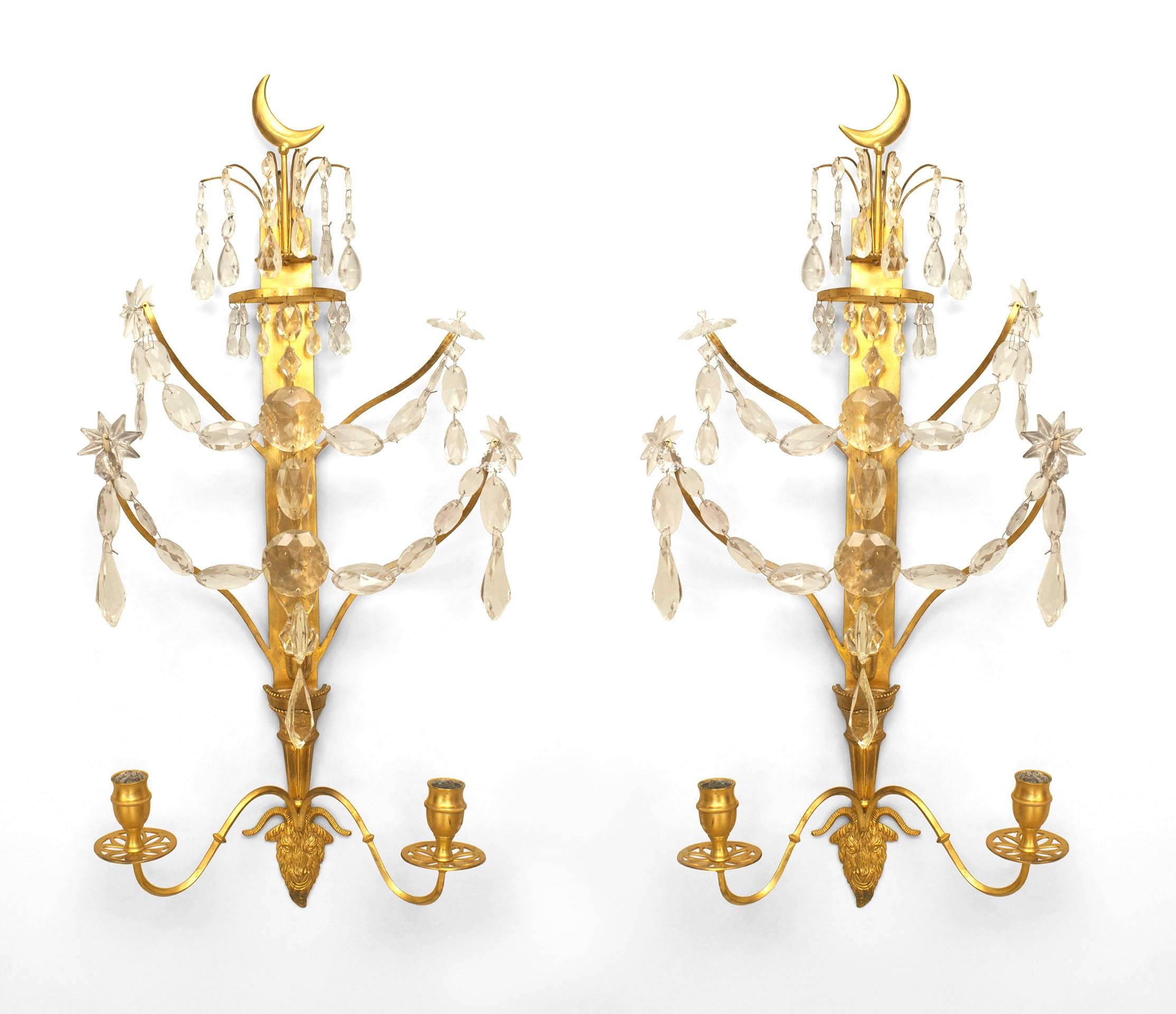 Pair of Continental (Baltic or Russian,1st quarter 19th Century) gilt bronze two arm wall sconces with crystal festoon design and a half moon form finial top. (PRICED AS Pair)
