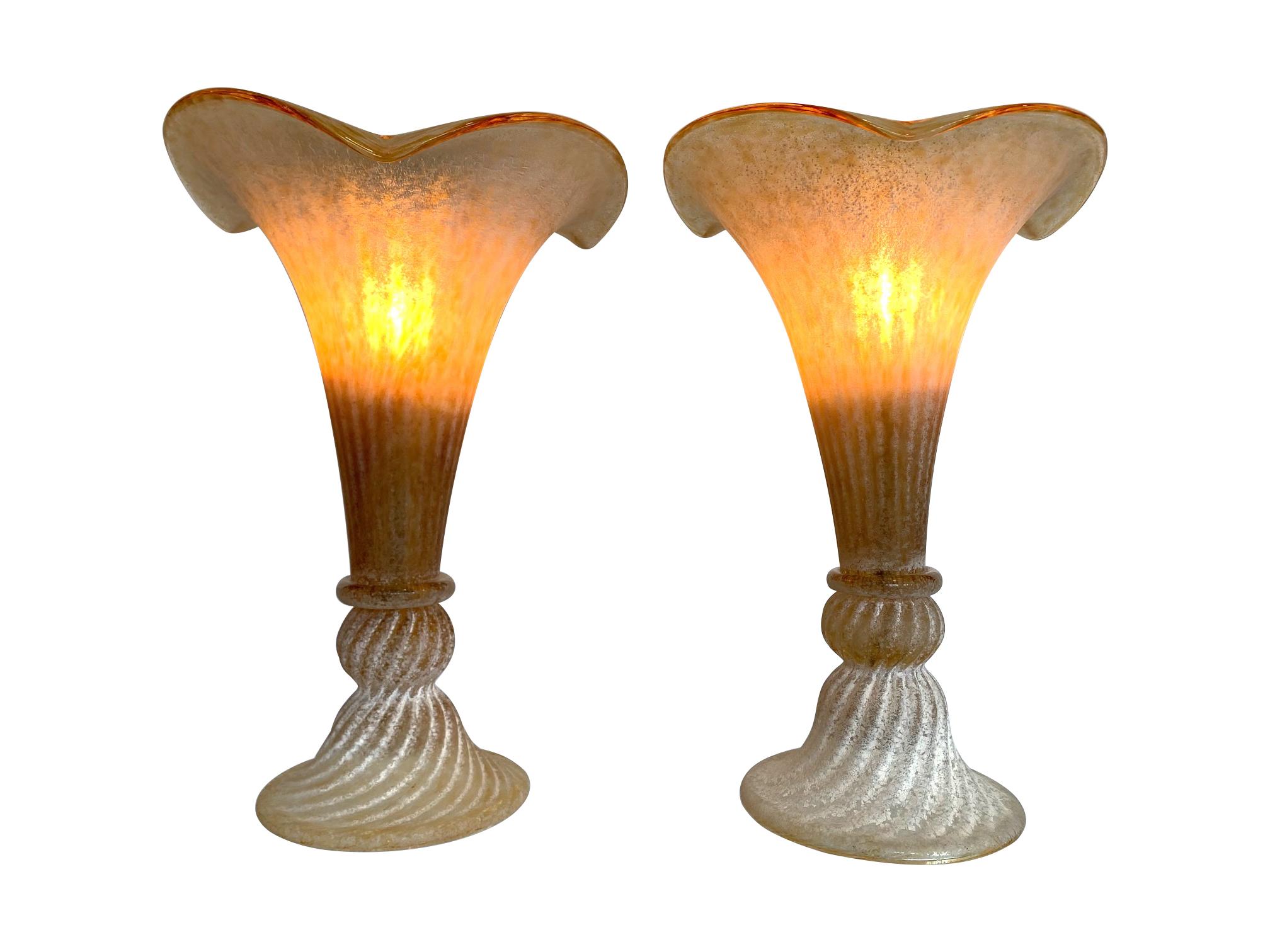 A lovely pair of fluted Murano glass lamps with mottled, ribbed finish in yellow, gold and white glass. Re wired with new brass fittings, antique gold cord flex and PAT tested.
 