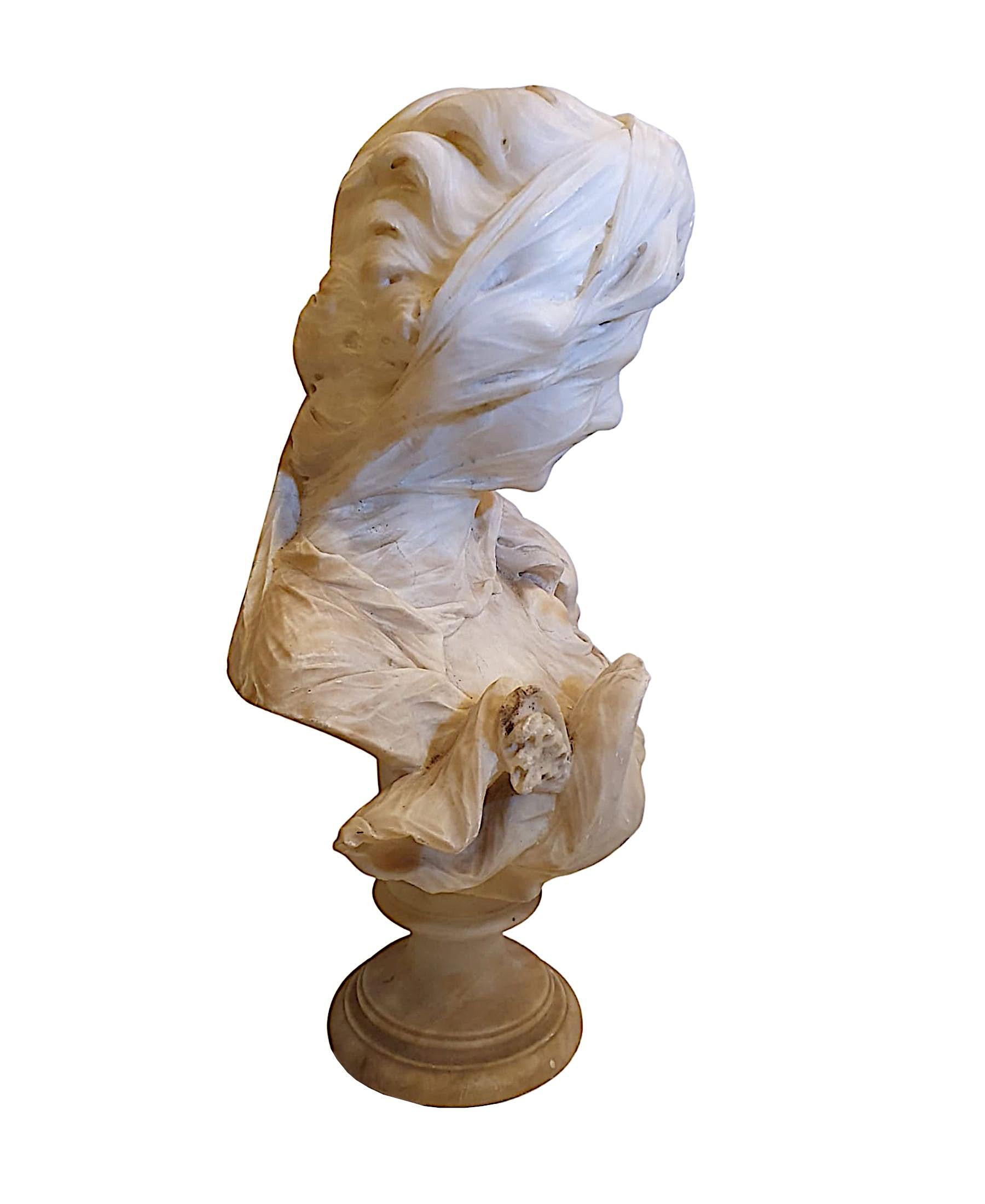 A lovely quality 19th century beautifully carved alabaster bust of a lady, de-picted smiling with a sheer veil obscuring her face and with hair tumbling over one shoulder supported on socle base, unsigned.