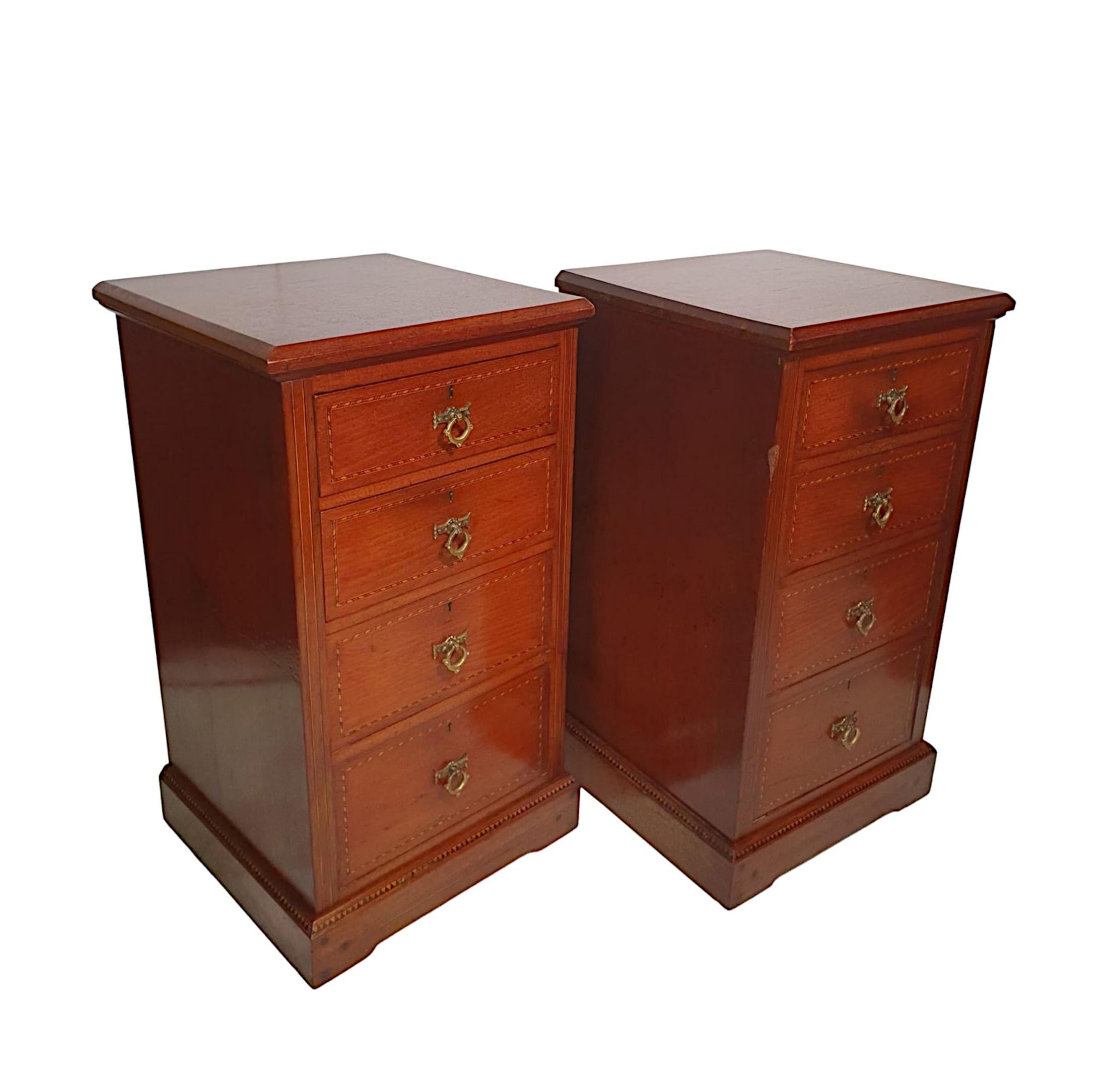 A lovely quality pair of 19th century walnut inlaid bedside chests. The moulded top raised over four graduated, line inlaid drawers fitted with brass escutcheons and decorative ring pulls, supported on inlaid platform base.