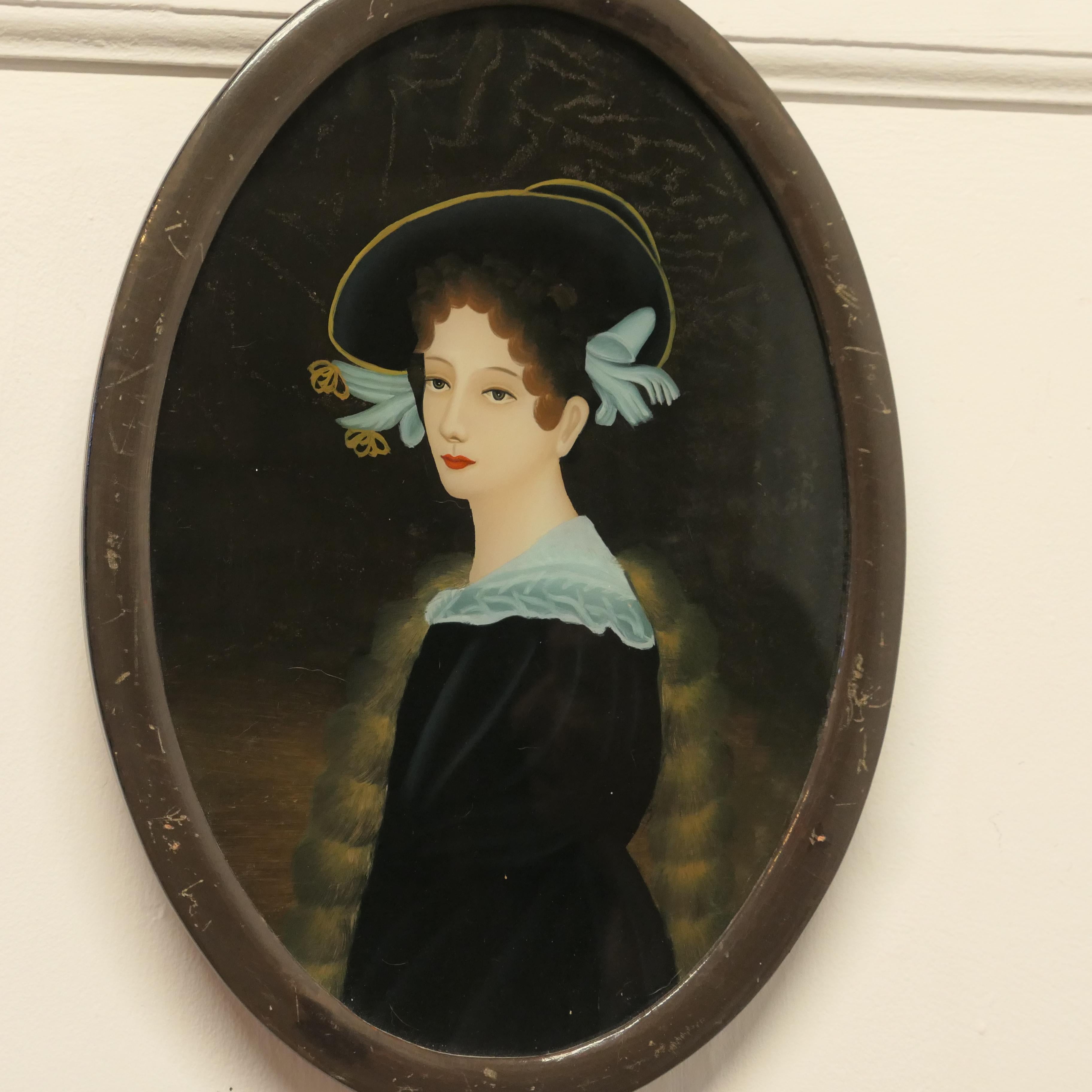 A Lovely Reverse Painted Portrait on Glass of An Edwardian Beauty

A truly skillful piece, this method of painting is known as Verre Eglomse

The painting is in good condition there is some scratching to the oval frame 
The Frame is 16” high, 11”