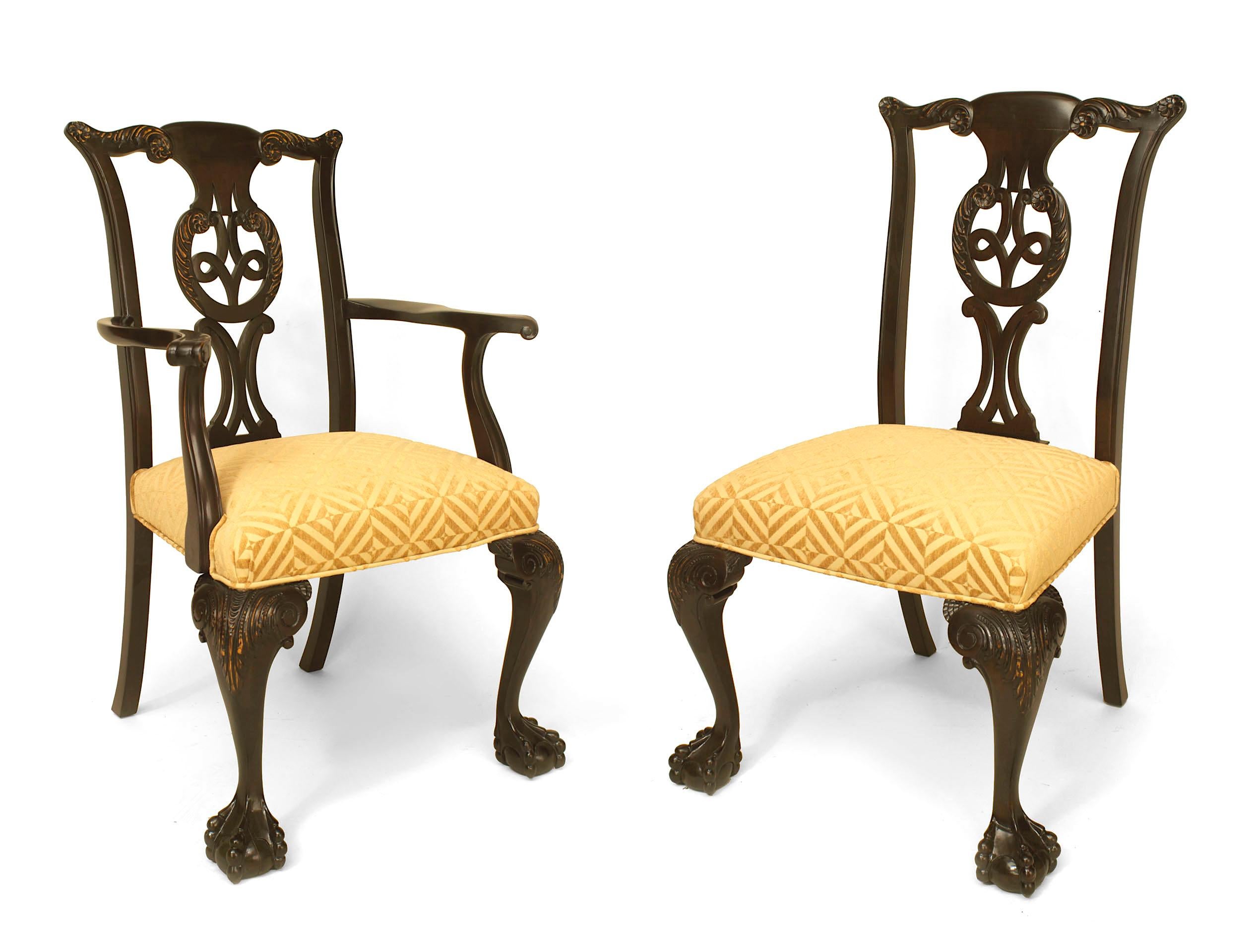 Set of 12 (2 arms/10 sides) Irish George II style (19/20th Cent) carved elm wood chairs with pierced carved backs and patterned chenille slip seats (arms 23