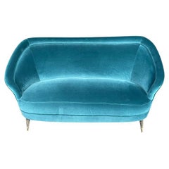 A lovely shaped orignal Italian 1950s two seater sofa with curved back
