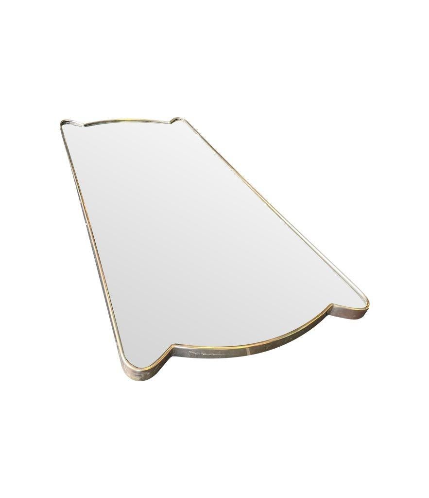 Brass A lovely unique shaped orignal 1950s Italian shield mirror with solid wood back For Sale