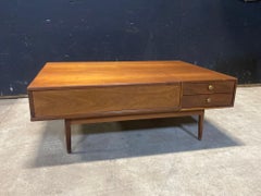 a Lovely Walnut coffee Table by Kip Stewart for the Drexel Declaration Line