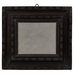 A Low Countries Deep Ebony Ripple Moulded Cushion Mirror