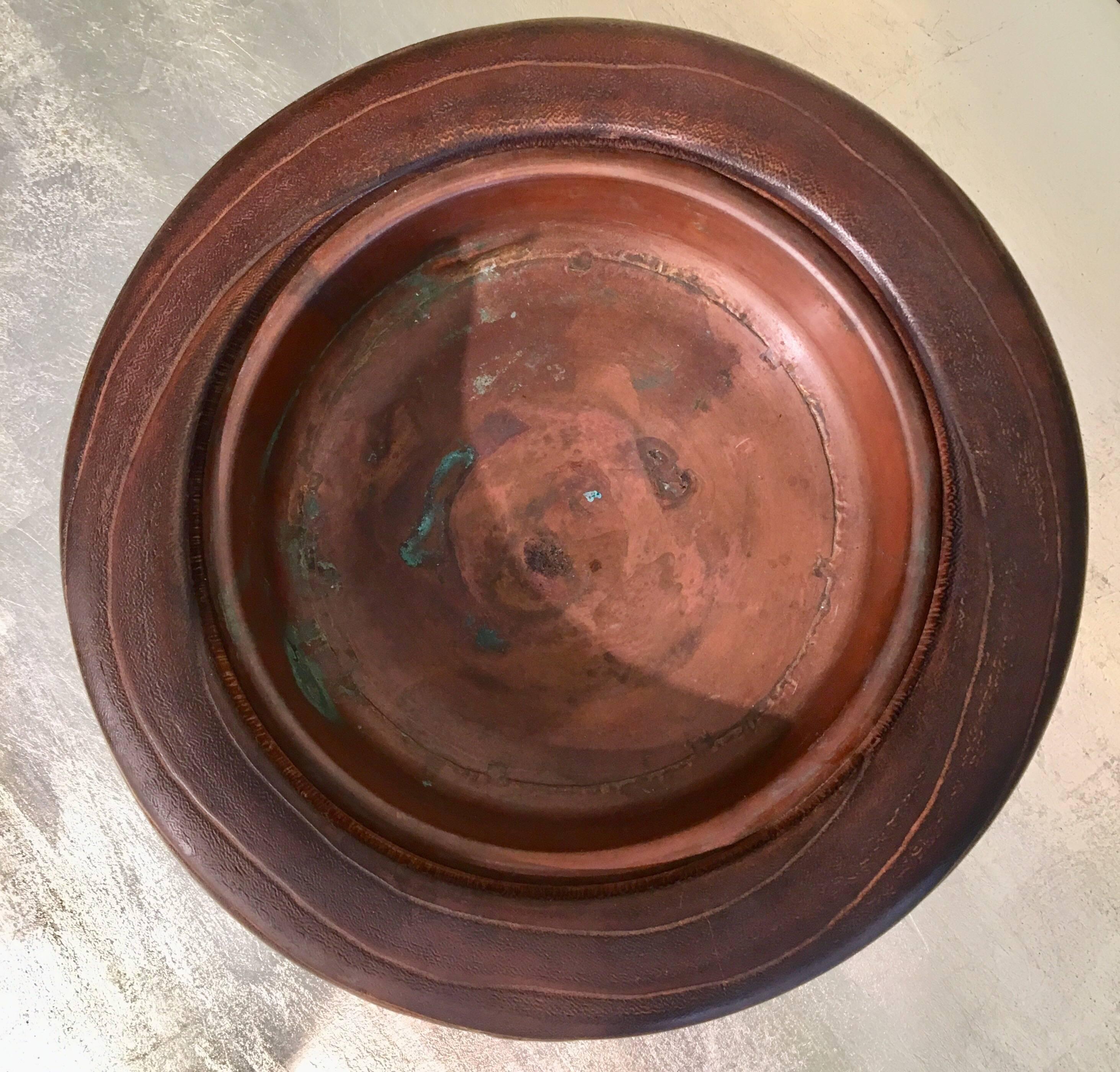 A low round antique Japanese wooden hibachi, with inlaid design of birds and leaves.