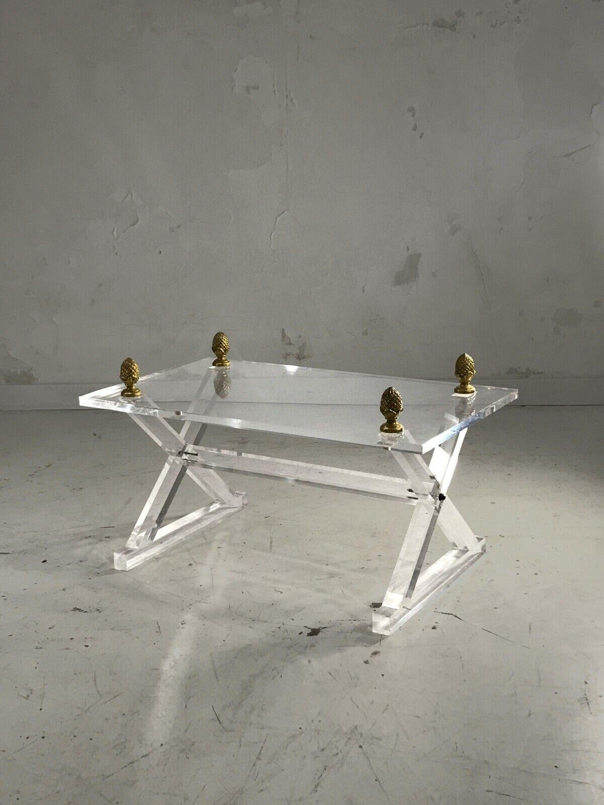 A superb rectangular Art-Deco, Neo-Classical, Shabby-Chic coffee or side table, X-shaped structure in solid plexiglass with a square section, rectangular top decorated with golden pine cones, to be attributed, France 1970.

DIMENSIONS: 90.5 x 50.5 x