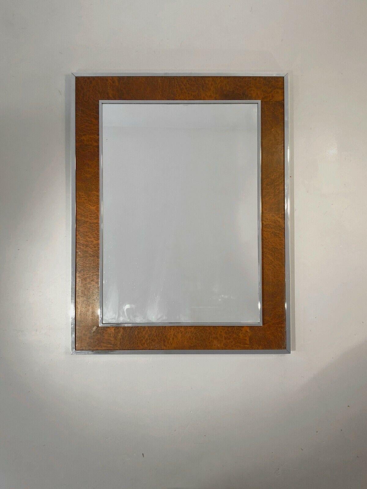 A luxurious rectangular wall mirror, Post-Modernist, Memphis, Shabby-Chic, with a frame decorated with a glowing leather-style elm burl veneer between 2 raised borders in chrome-plated metal of square section, with beautiful, very sharp finishes,