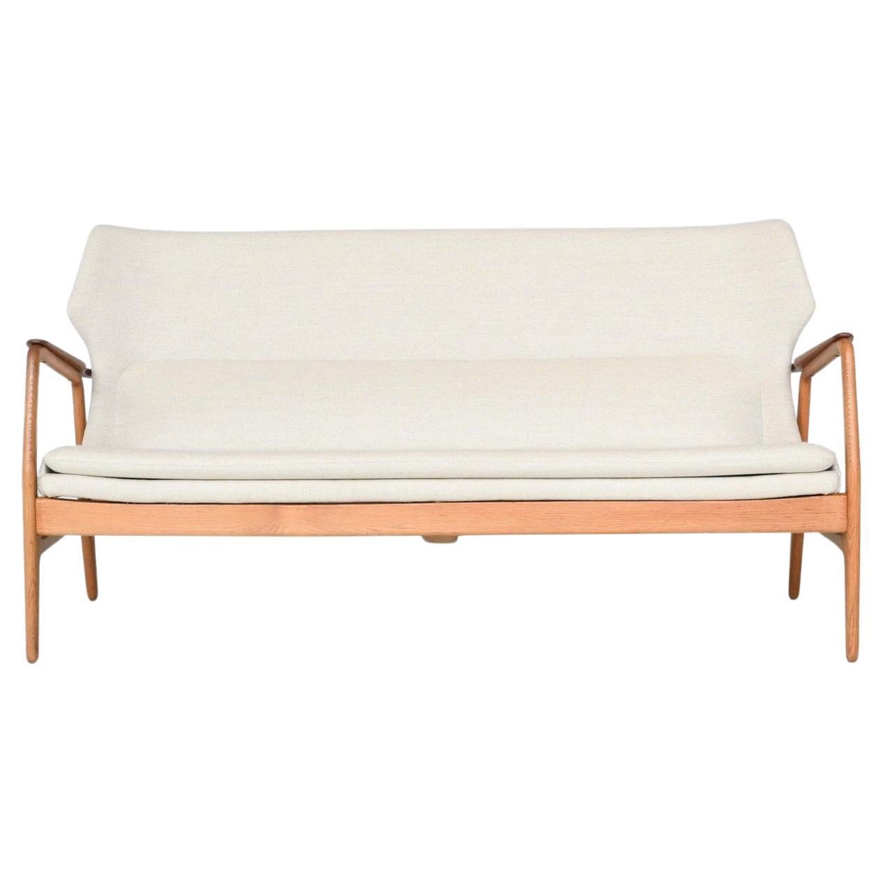 A. Madsen & H. Schubell Wingback sofa in cream Bovenkamp The Netherlands 1960 For Sale