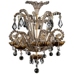 Un magnifique lustre antique à cascades, composé de bagues en bronze doré, de cristal et de perles de verre